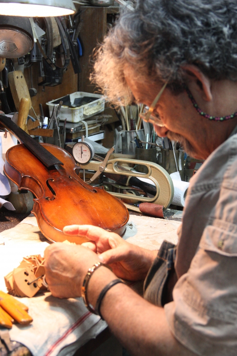 Amnon Weinstein restores violins with an emotional history. Photo by Debra Yasinow