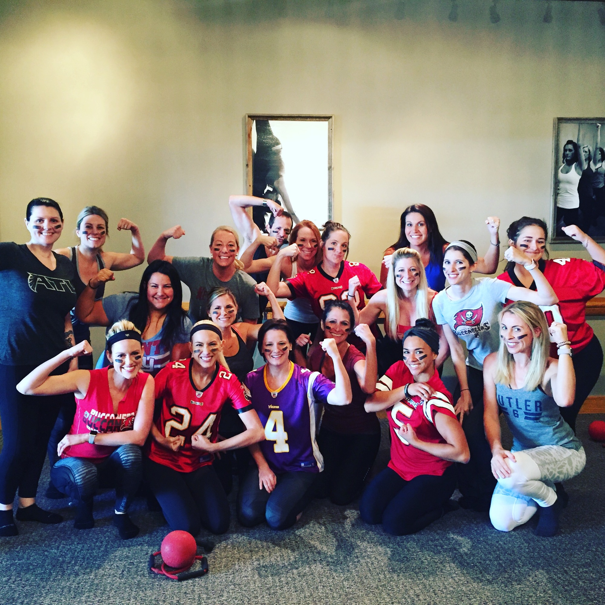 Guests at “Brunch & Burn Before the Big Game” show off their muscles at Pure Barre on Feb. 5. Photo courtesy of Montana Taplinger