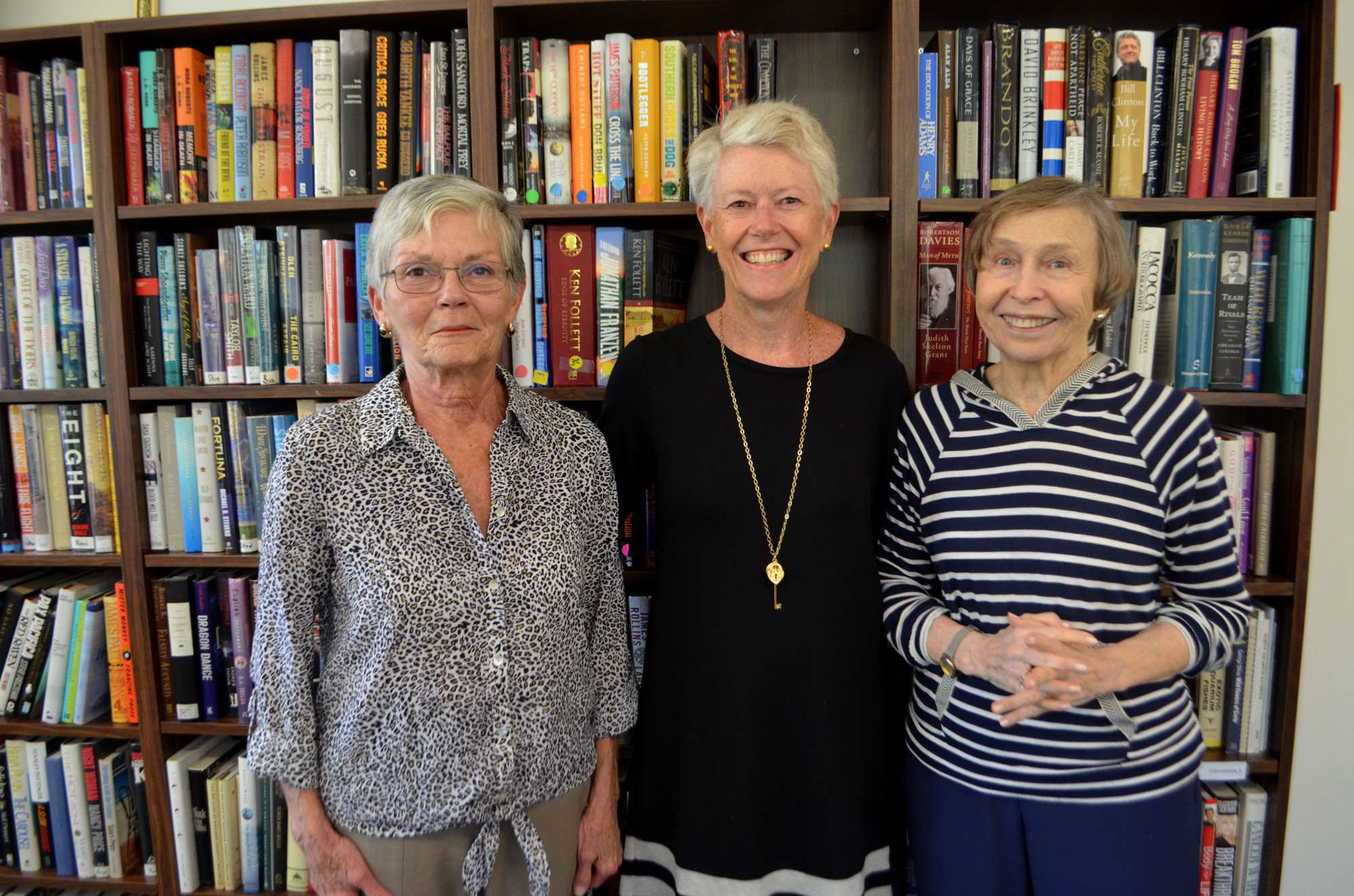Volunteer Joan Rotenberg, Co-President  Mary Baker and Publicity Chairwoman Carolyn Mangel are just three of the 55 volunteers who keep the library running. 