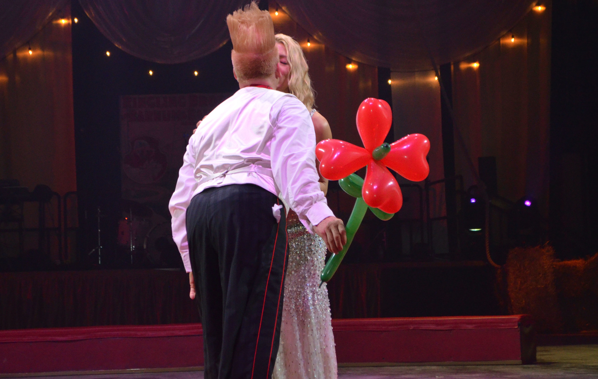 Bello Nock gives Jennifer Steube a surprise peck on Feb. 25 at the Big Top Gala at Feld Entertainment Studios. Photo by Niki Kottmann