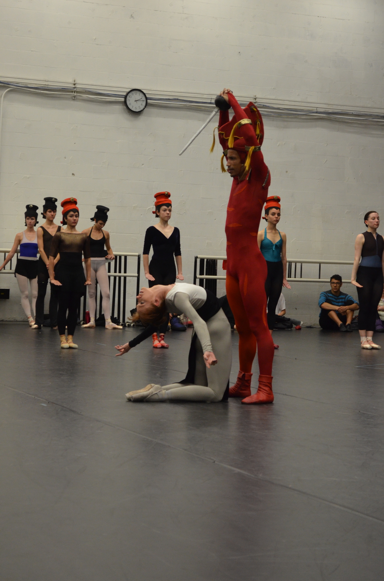 Ricardo Rhodes, as the Red Knight, prepares to stab Danielle Brown, the Black Queen.