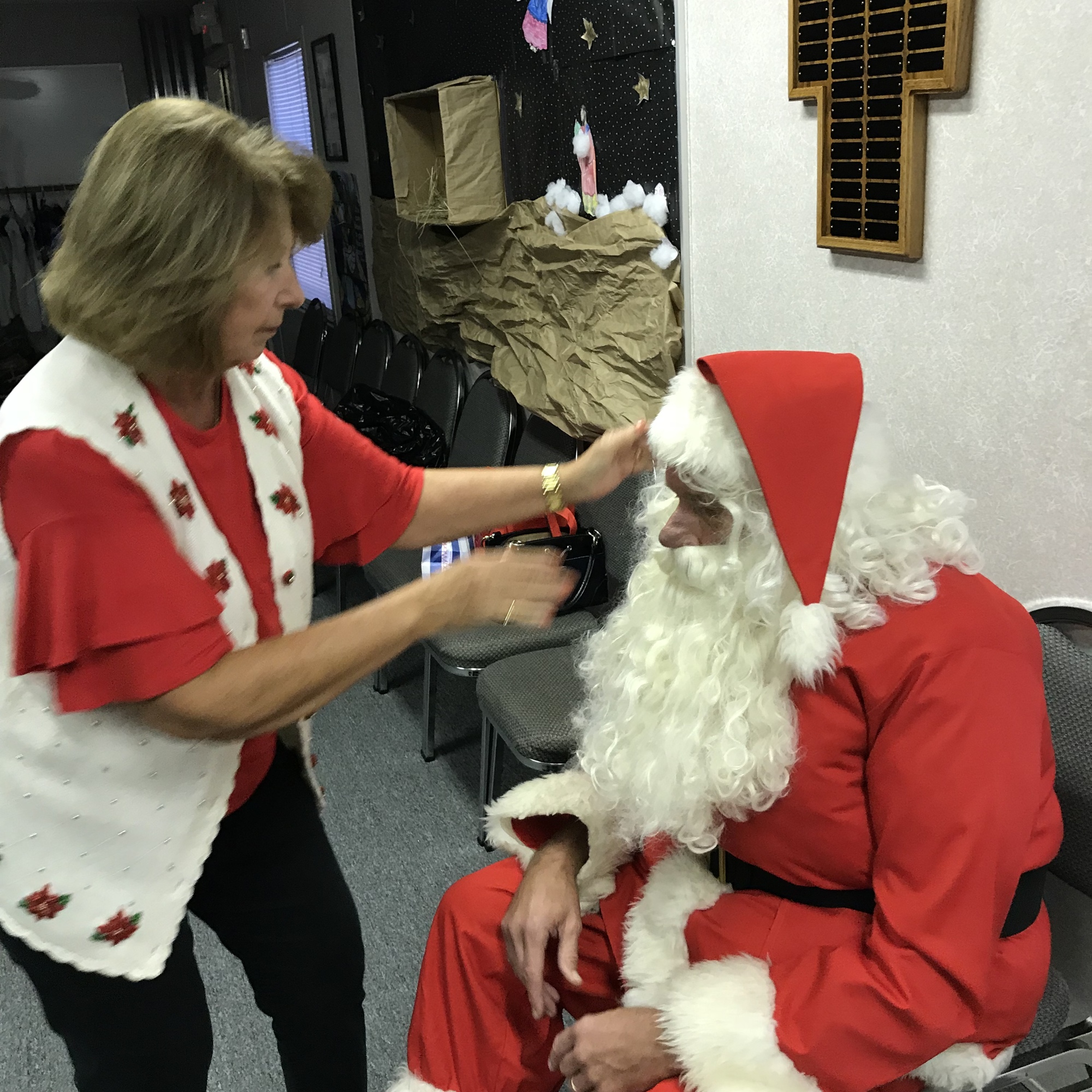 Regina Joly lends a hand to a very special Santa. Courtesy photo