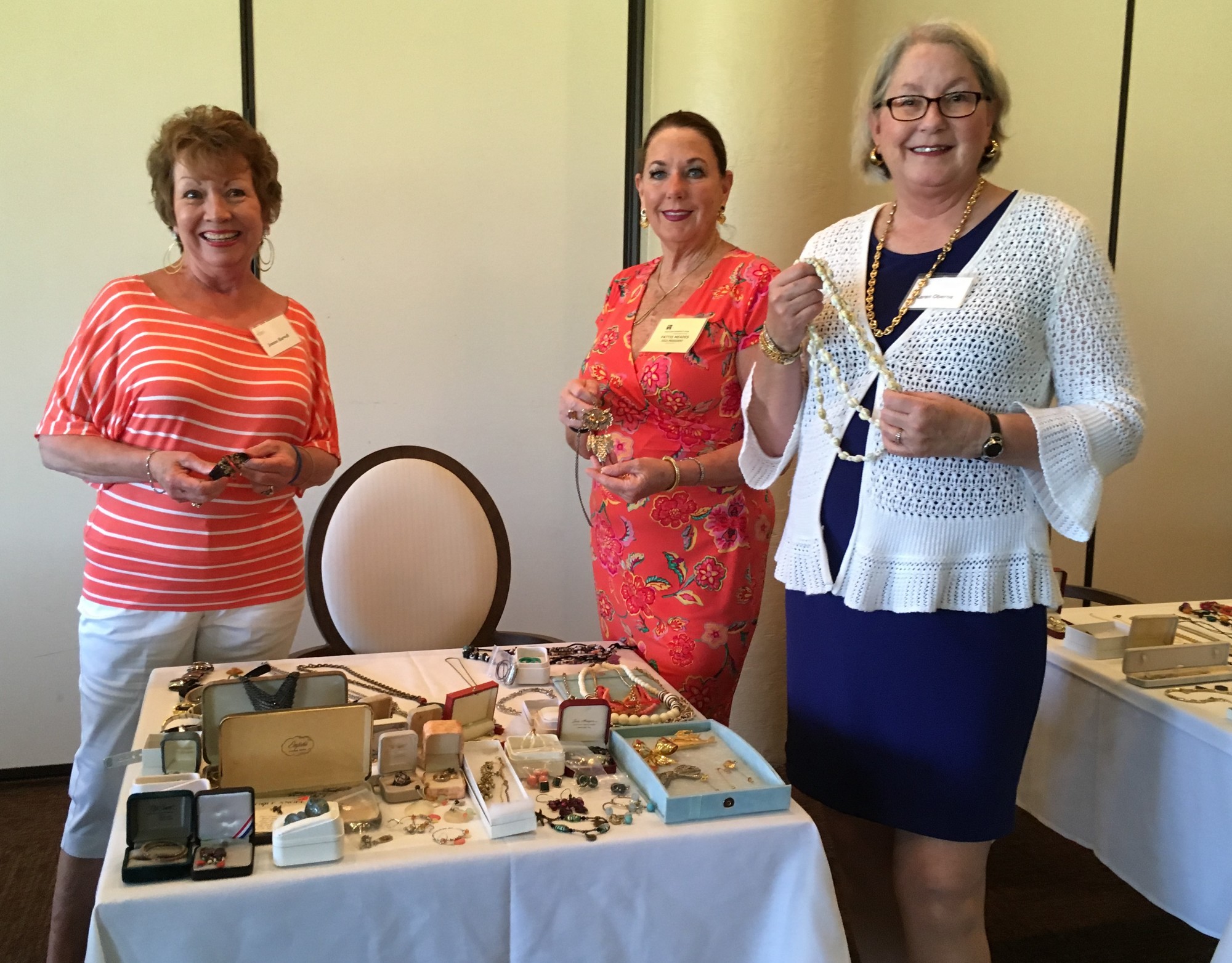 Joanne Harwell , Pattie Meades and Karen Oberne check out the jewelry for sale at the luncheon. Photo courtesy of Meg Garofalo.