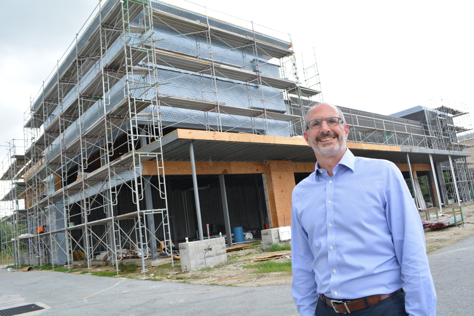 Benderson Development Co. Director of Florida Leasing Mark Chait shows off a new 10,000-square-foot building between LA Fitness and Courtyard by Marriott. It will house a Greek restaurant and a spa, along with two other businesses