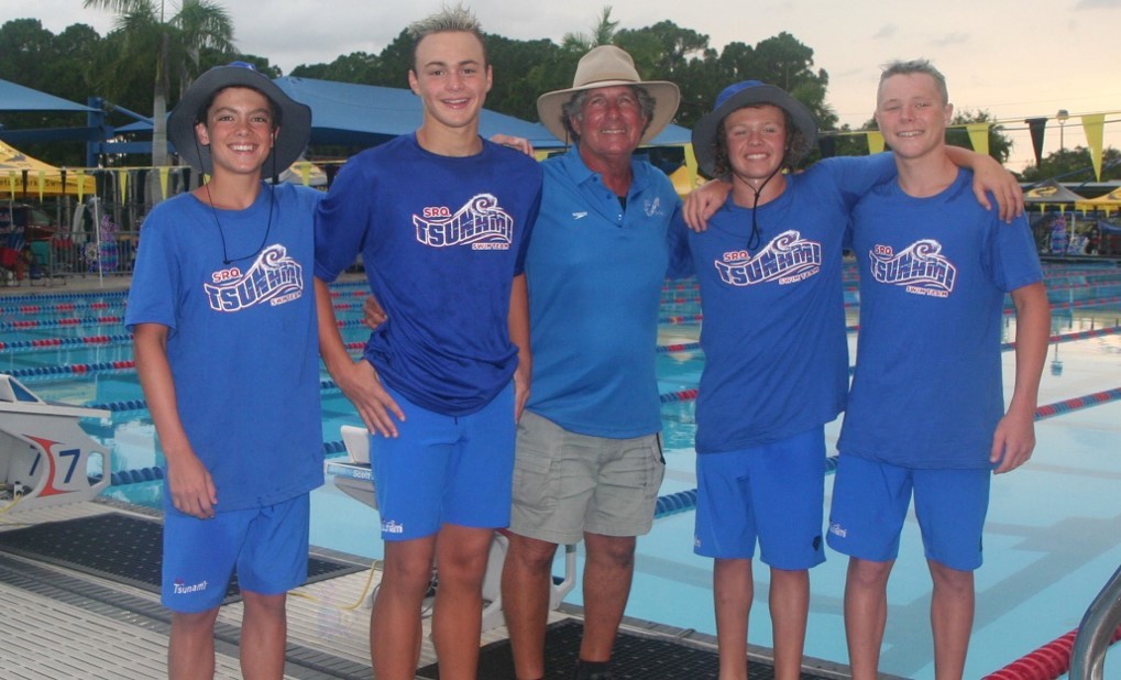 Cole Firlie, Dimiter Zafirov, Tsunami head coach Ira Klein, Colton Frantz and Evan Keogh pose after the swimmers set the Florida long course record in the boys 800 freestyle (8:08.84) at FLAGS. Photo courtesy Tricia Zafirov.