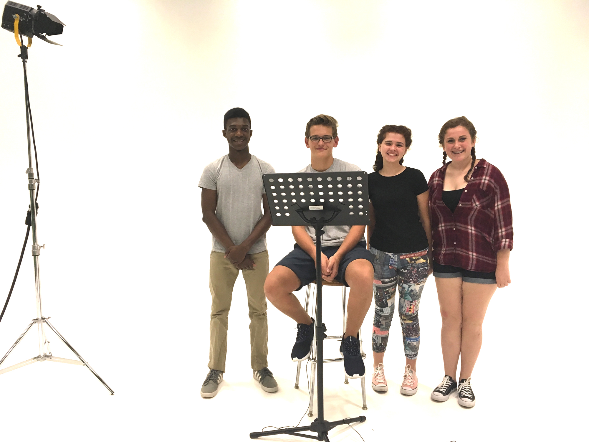 Sarasota students Nick Blake, Connor Andritch, Minnah Stein, and Emma Knego record voiceovers for the national educational video 