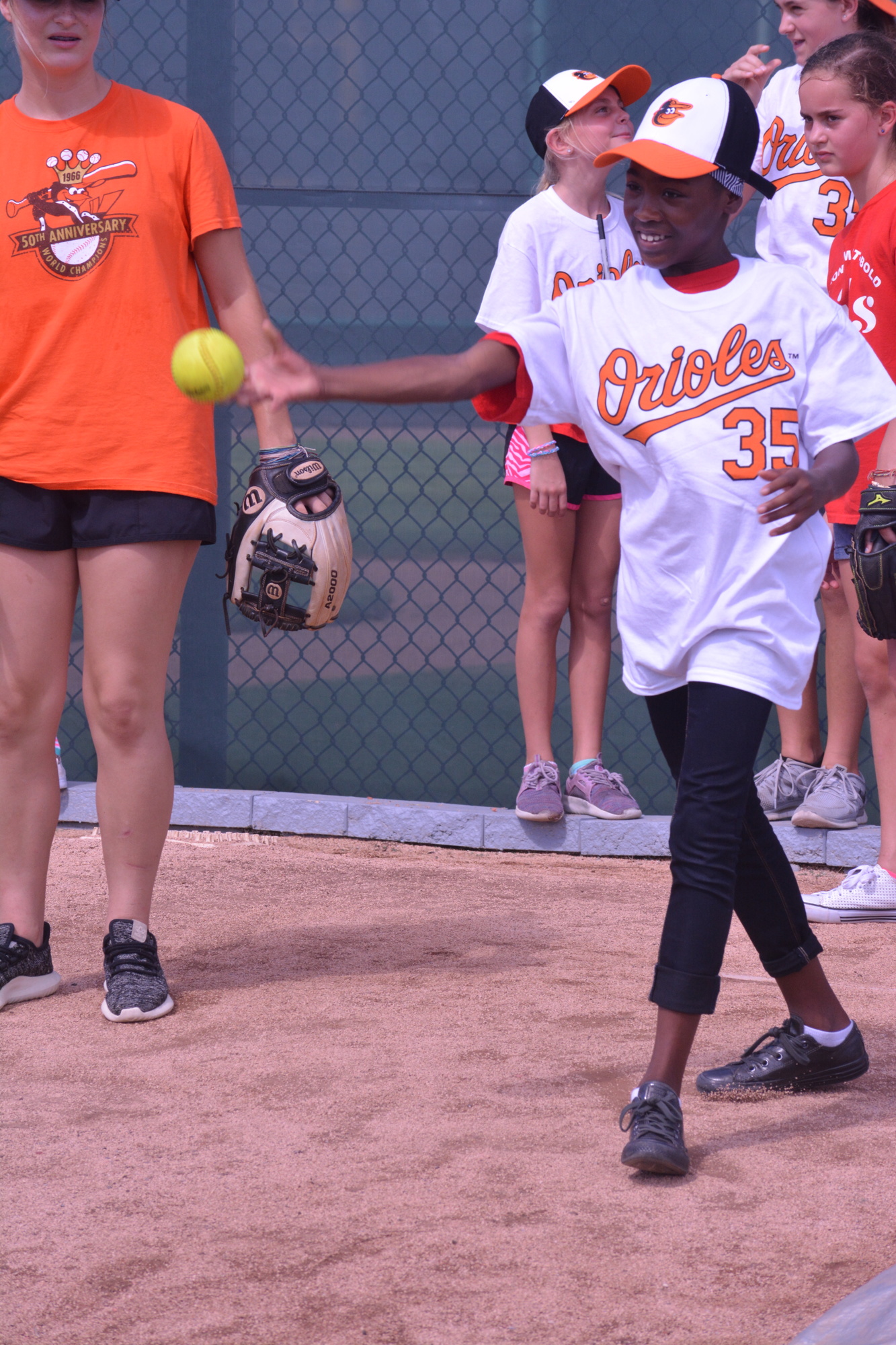 Zhenasia learns to pitch at the Orioles Girls Inc. clinic on July 27.