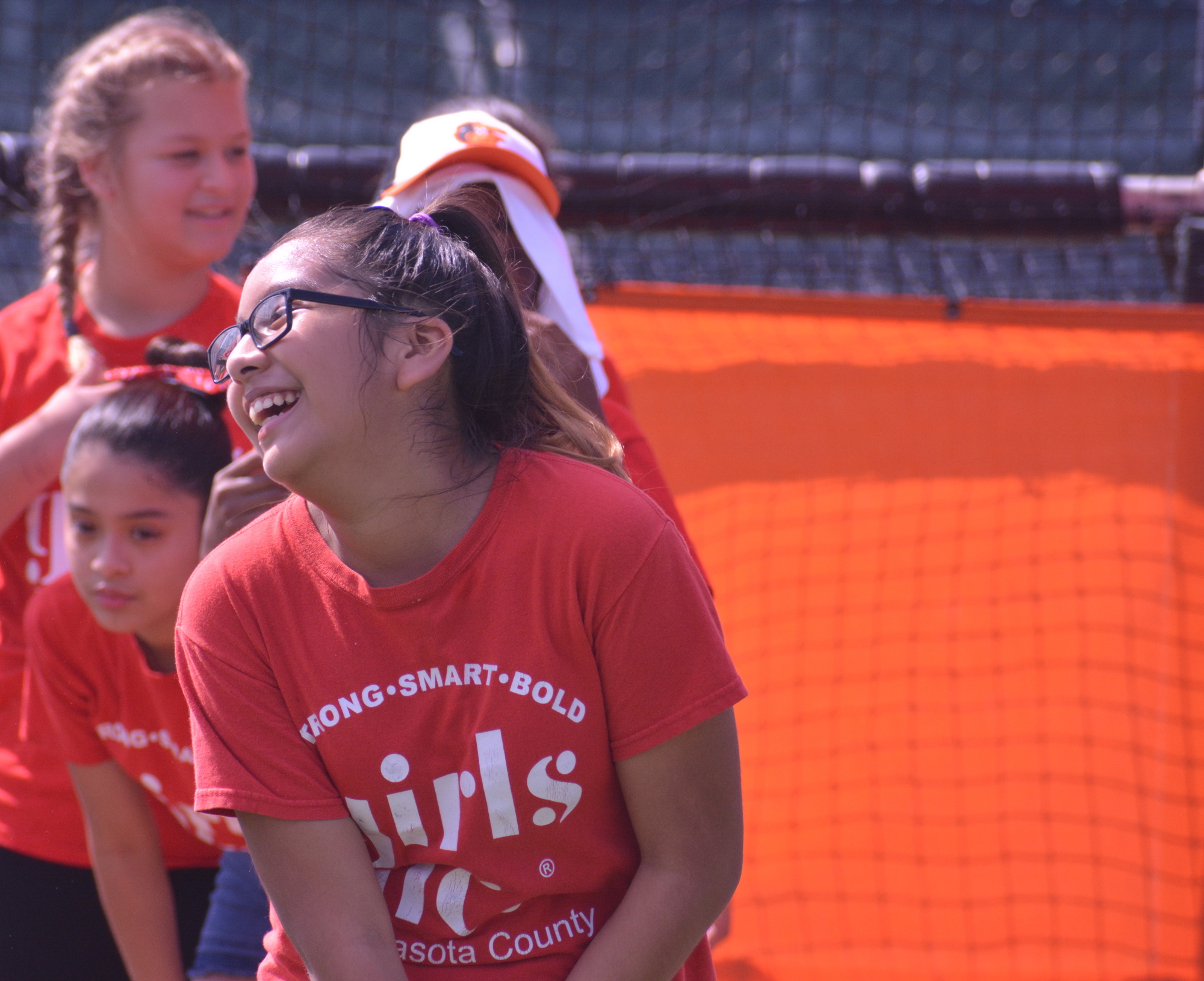 Getzemany laughs after swining at the Orioles Girls Inc. clinic on July 27.