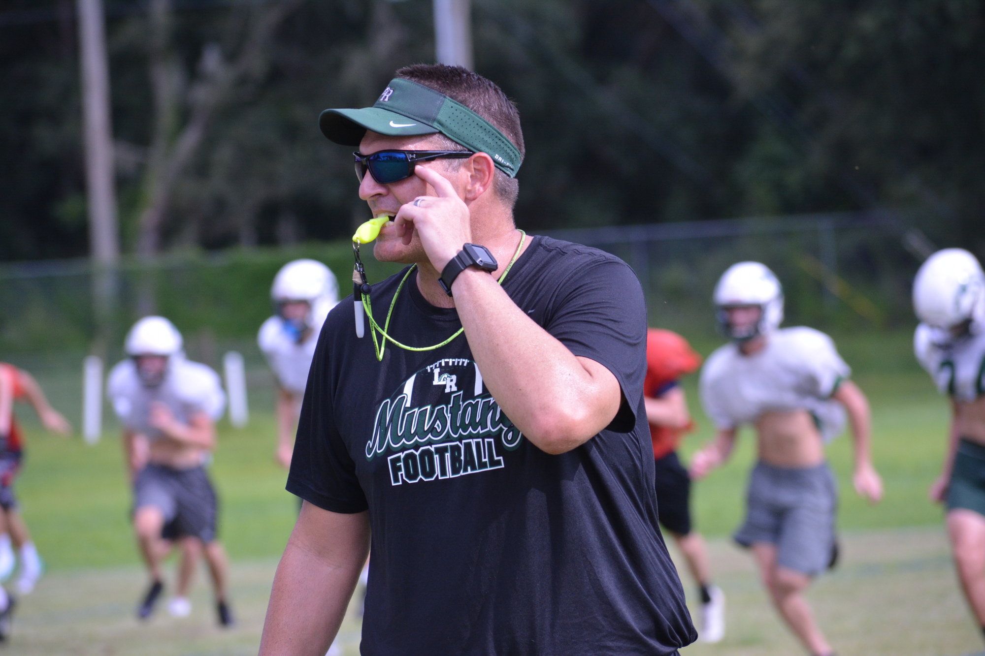 Lakewood Ranch coach Chris Culton gives instruction at practice.