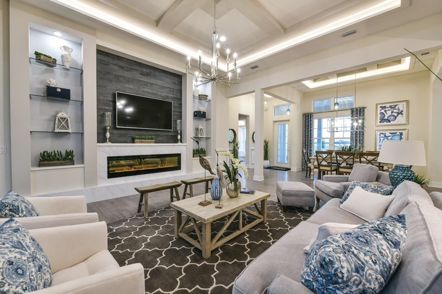 Blue and white are the classic coastal colors, seen here in the gathering room of the Homes by Towne Tideland model.