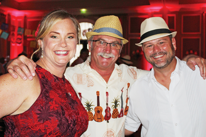 Lakewood Ranch’s Erica Mulder, who helped plan the event, enjoys a moment with Randy Bringman and Mark Mulder.