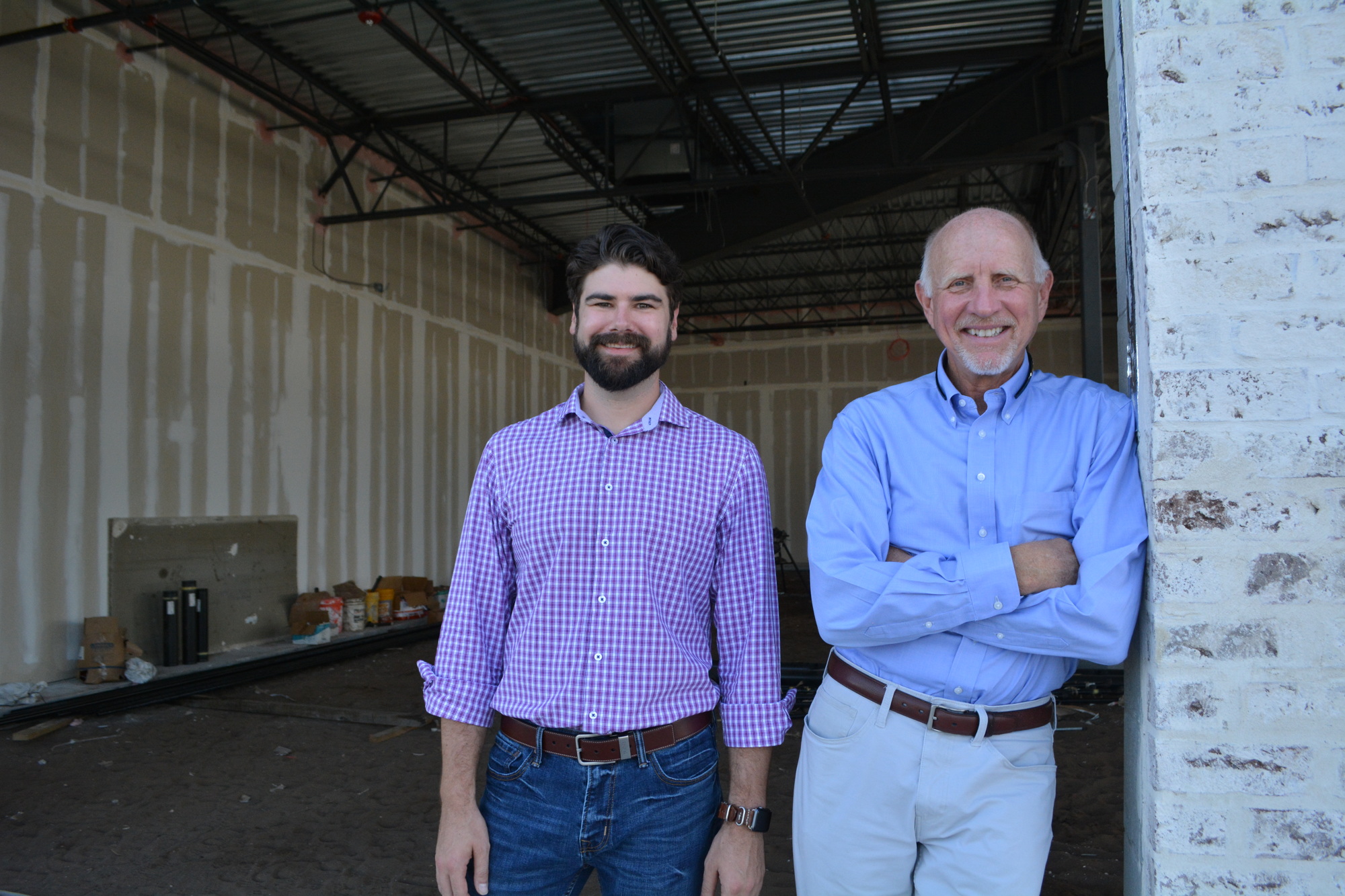 North American Properties Vice President Craig Kopko and Partner Dale Hafele stand in the future space for Libby's Cafe and Bar at University Corner. The restaurant is exactly what they hoped to attract to the new shopping plaza.