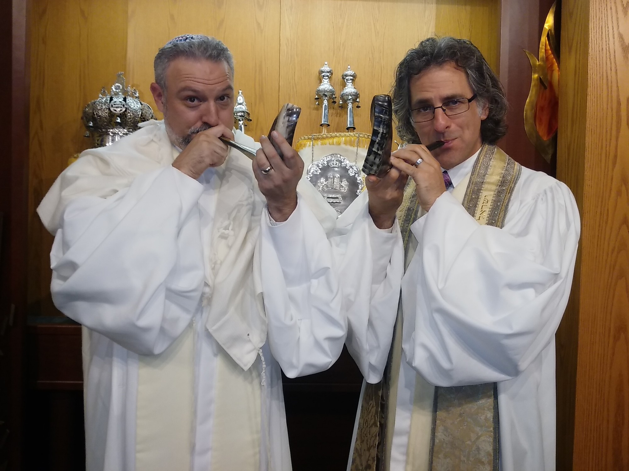 Temple Emanu-El Senior Rabbi Brenner Glickman and Associate Rabbi Michael Shefrin blow the shofar, the ritually-prepared ram’s horn that is traditionally sounded on the morning of Rosh Hashanah and at the very end of Yom Kippur.