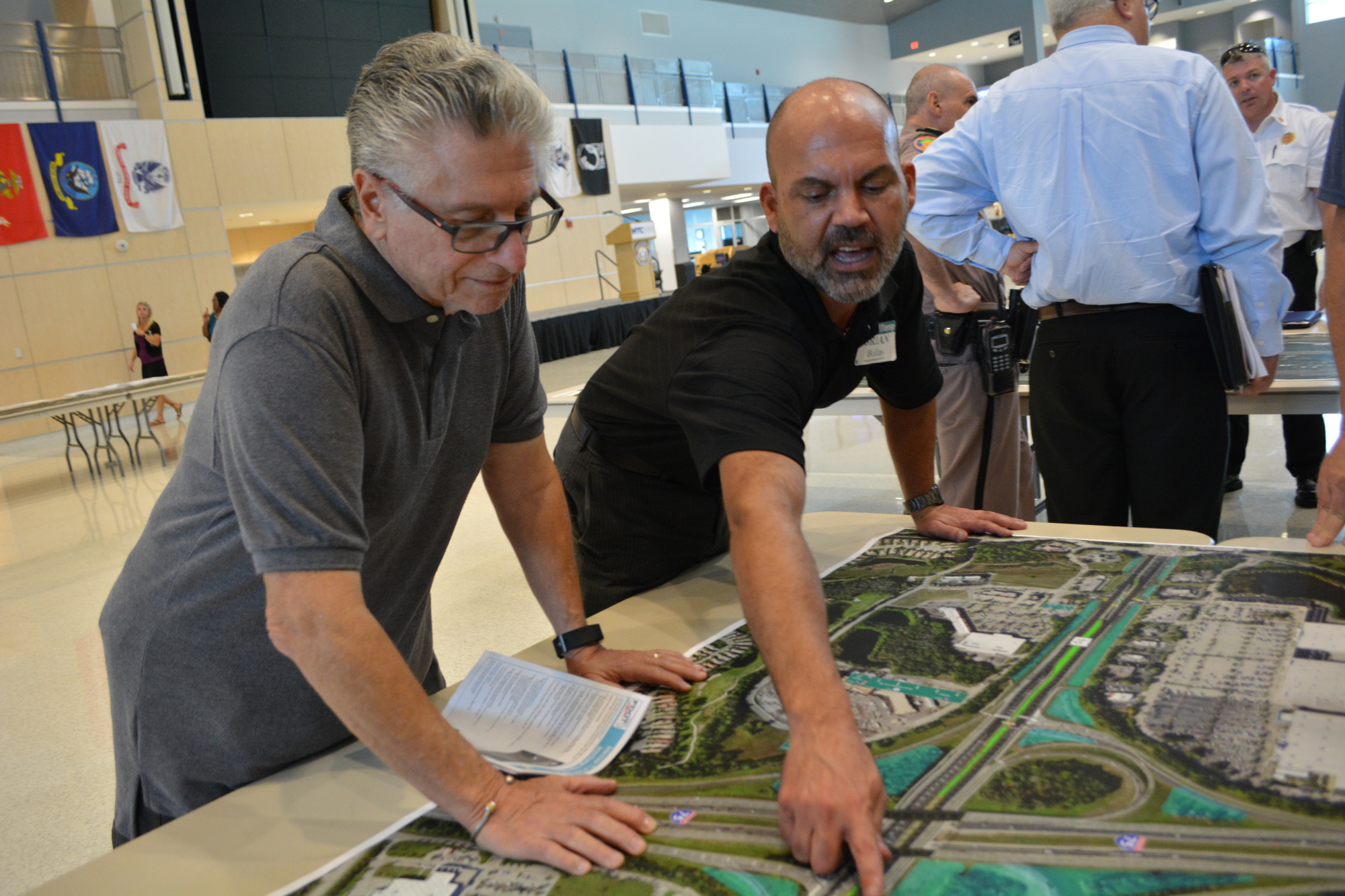 FDOT project spokesman Brian Bollas, right, answers questions about traffic patterns from Ray Notaro, of River Place.