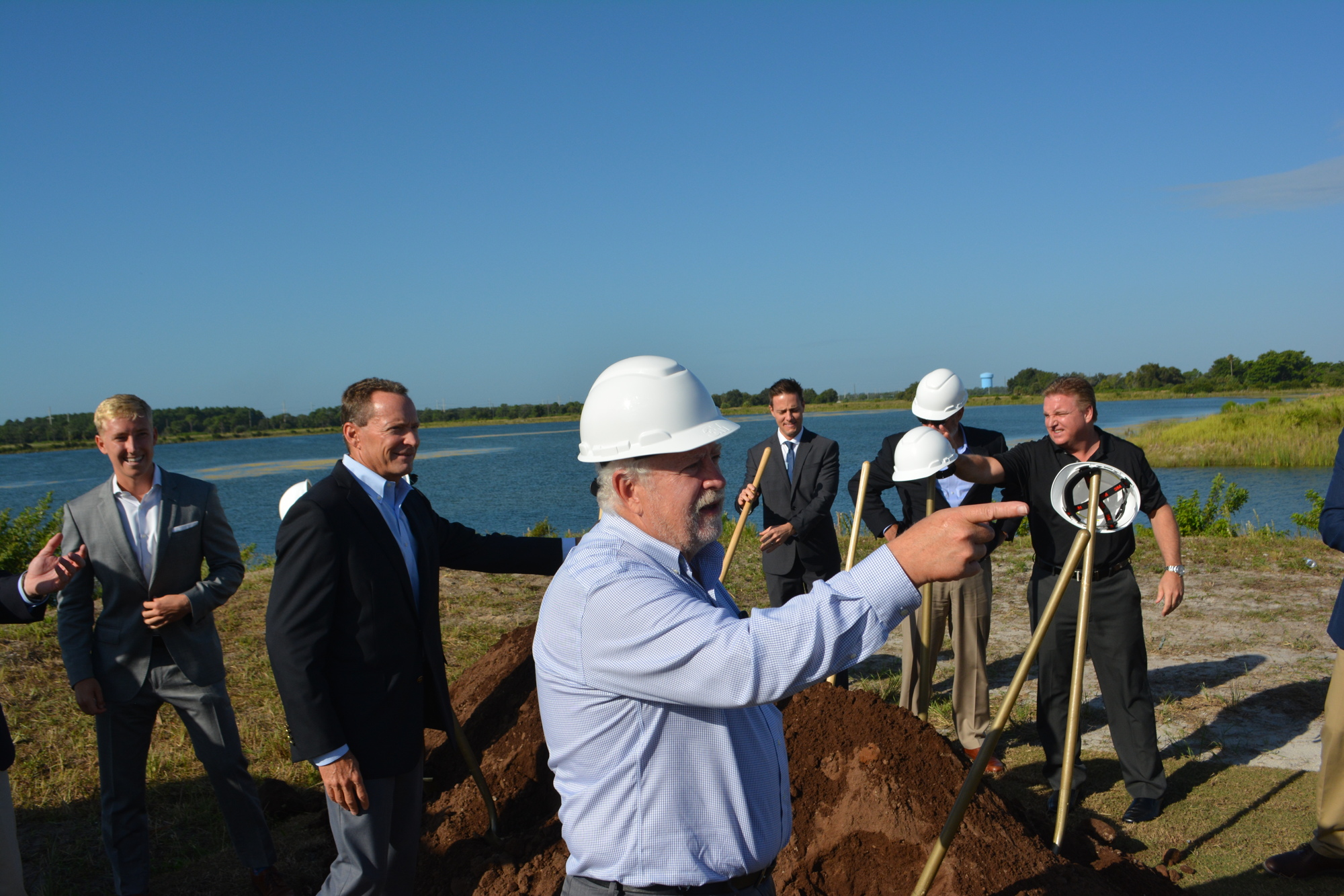 SMR CEO and President Rex Jensen leads a groundbreaking ceremony for Waterside Place.