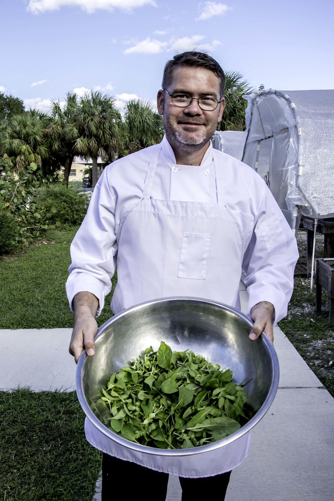 Courtesy photo Veteran Brett Jones shows off his fresh ingredients at the 2017 Veterans Farm-to-Table Dinner during Eat Local Week. Courtesy photo