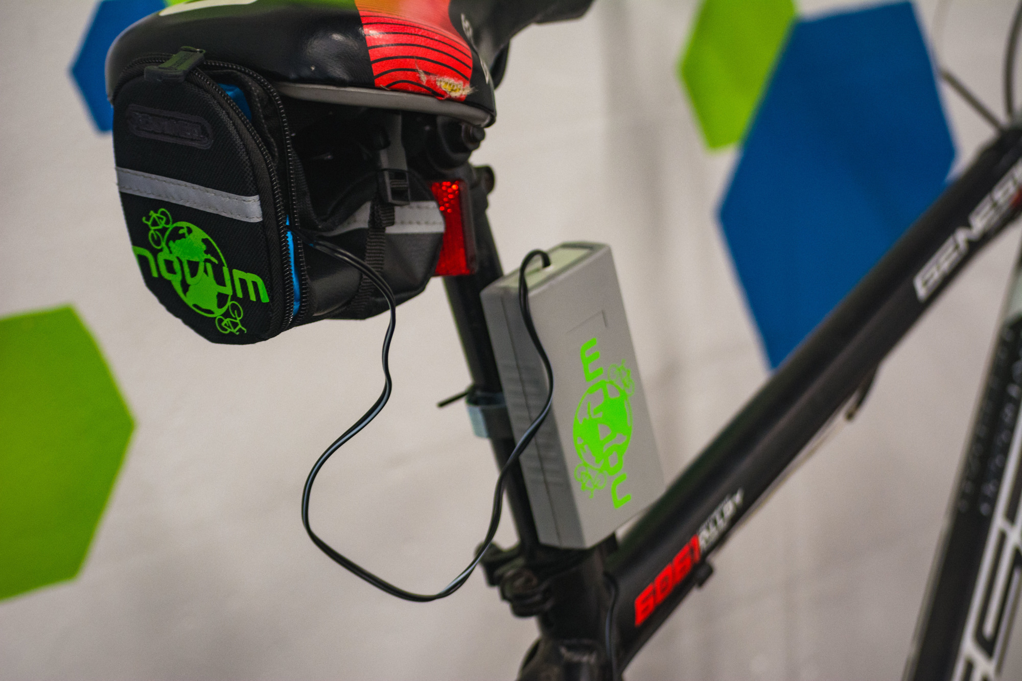 A close-up of Novum, a device that charges cell phones through the power of pedaling a bike.