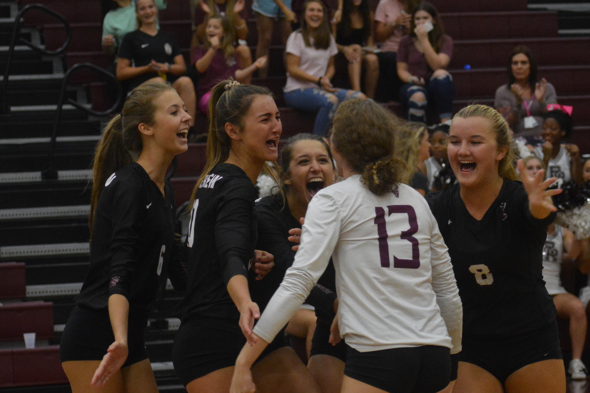 The Rams celebrate wining the first point o the game against Dr. Phillips High. They would eventually win the match 3-1.