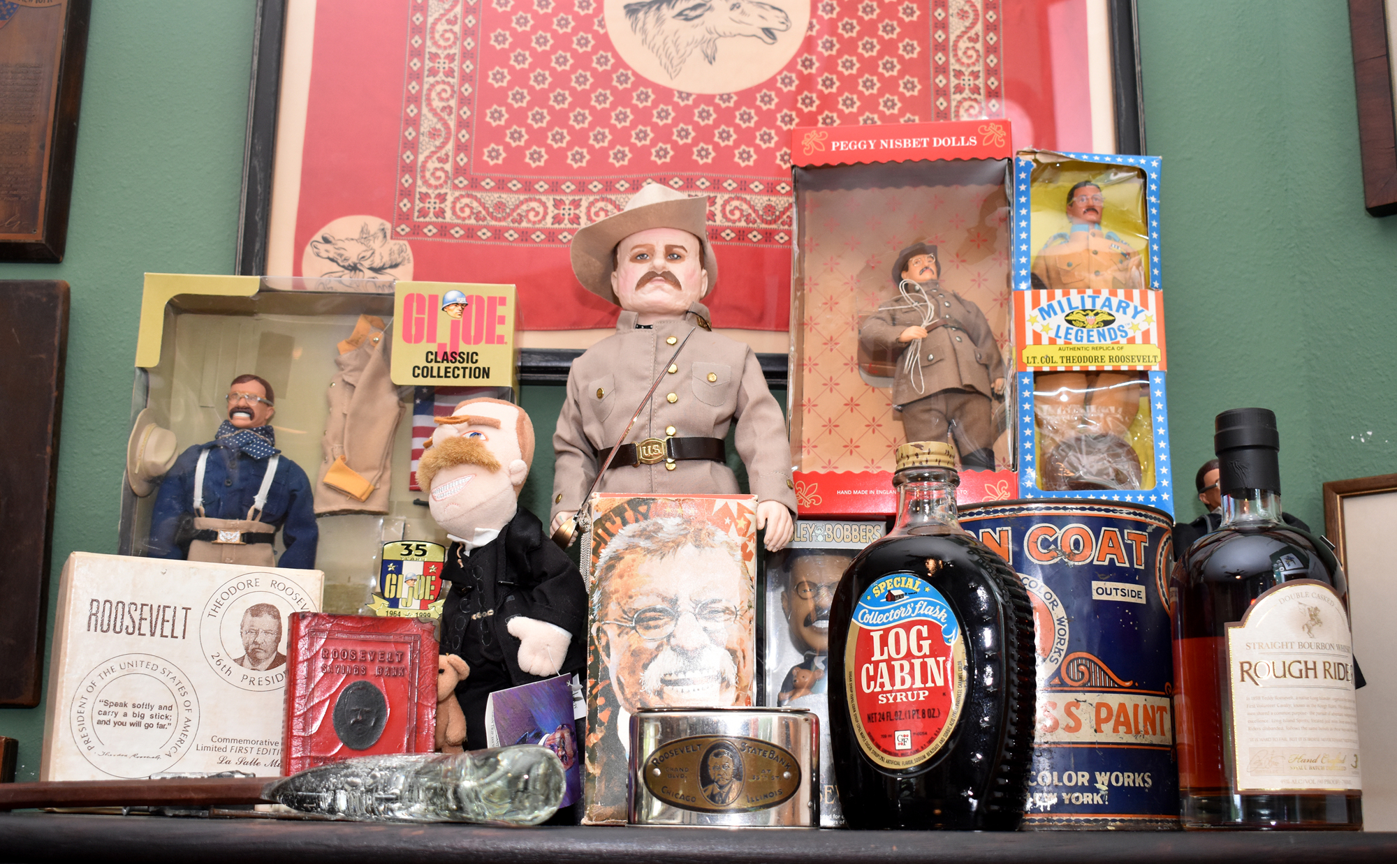 While his office walls are lined with posters, plaques and paintings, Maass fills shelves with smaller items, like dolls, bottles and pins.