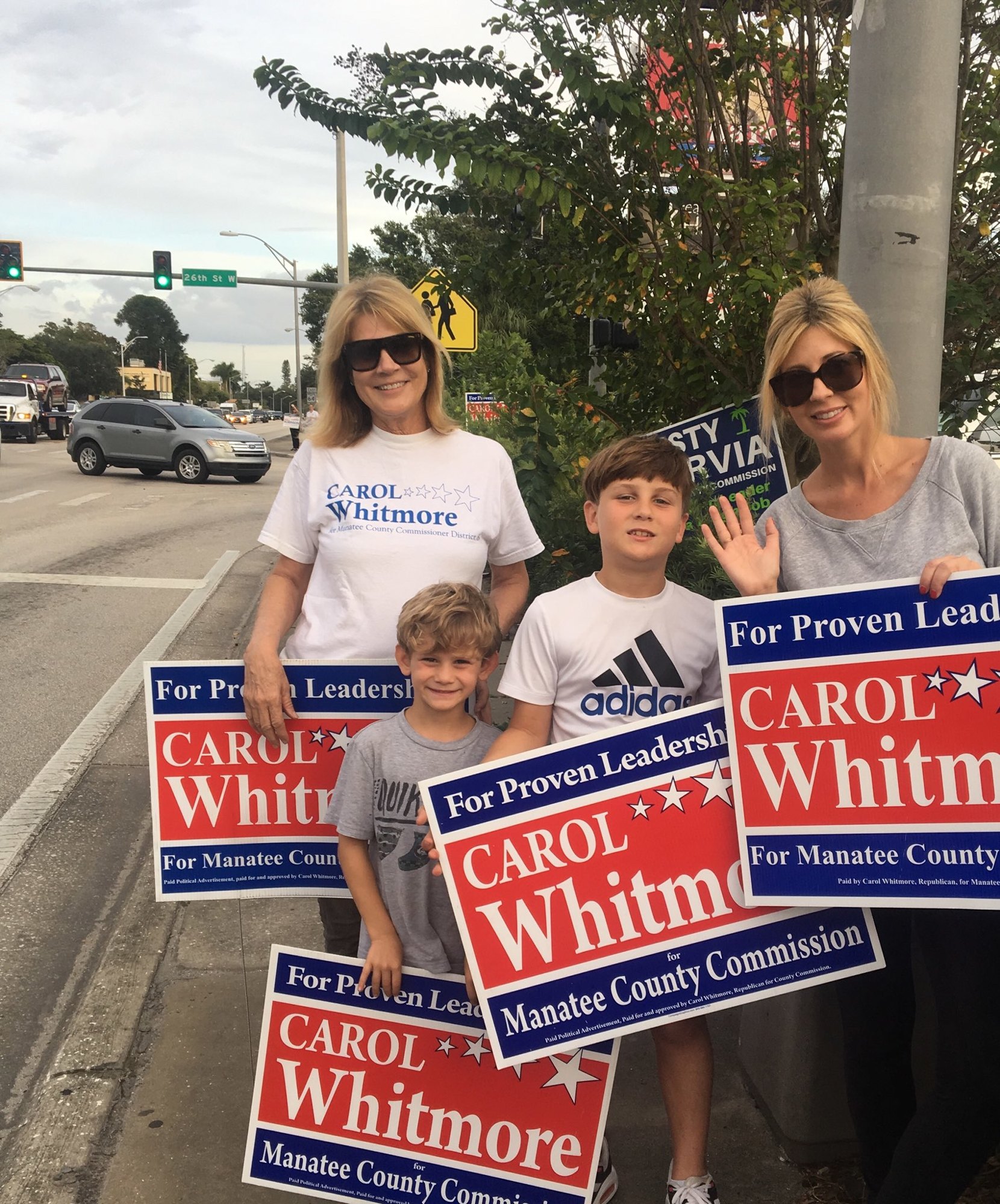 At-Large Commissioner Carol Whitmore got help from her family waving signs on election day. She is pictured with her grandchildren and daughter, Camden, Cale and Janae Rudacille. Courtesy photo.