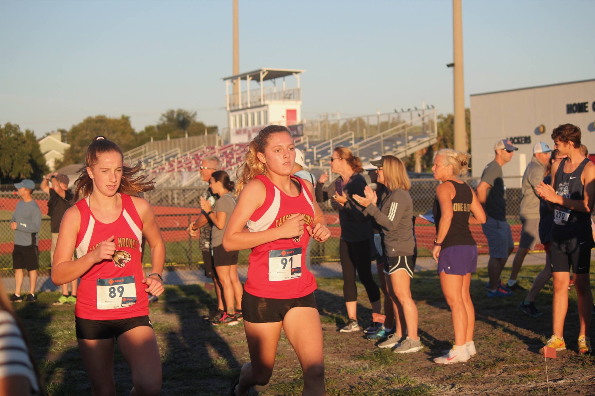 Rachel Jarrett and Hallie Monserez run side by side. Photo courtesy Pam Landers.