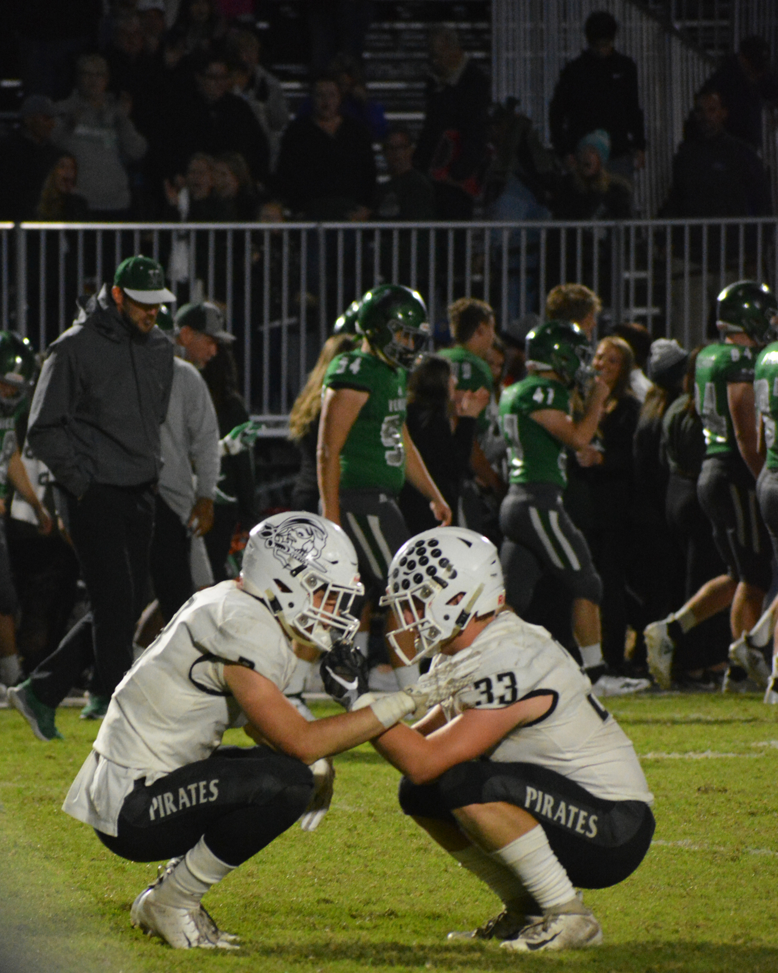 Braden River junior Noah Font consoles senior Jackson Dietz after the final whistle. The Pirates lost 28-21 to Venice.