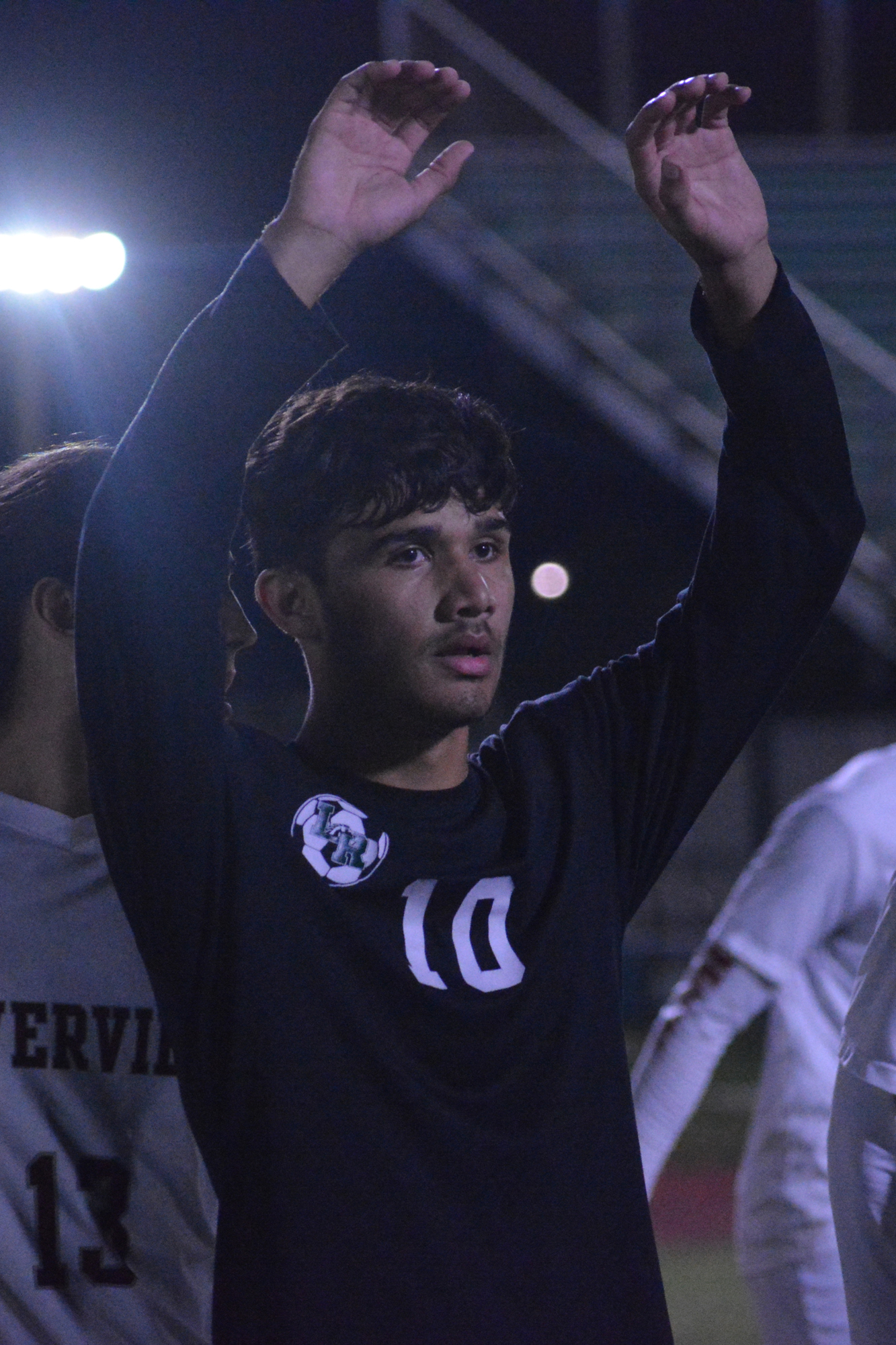 Mustangs senior Wilmer Yanez raises his hands before a corner kick to block defenders' view. Yanez leads the team with 11 goals through eight games.