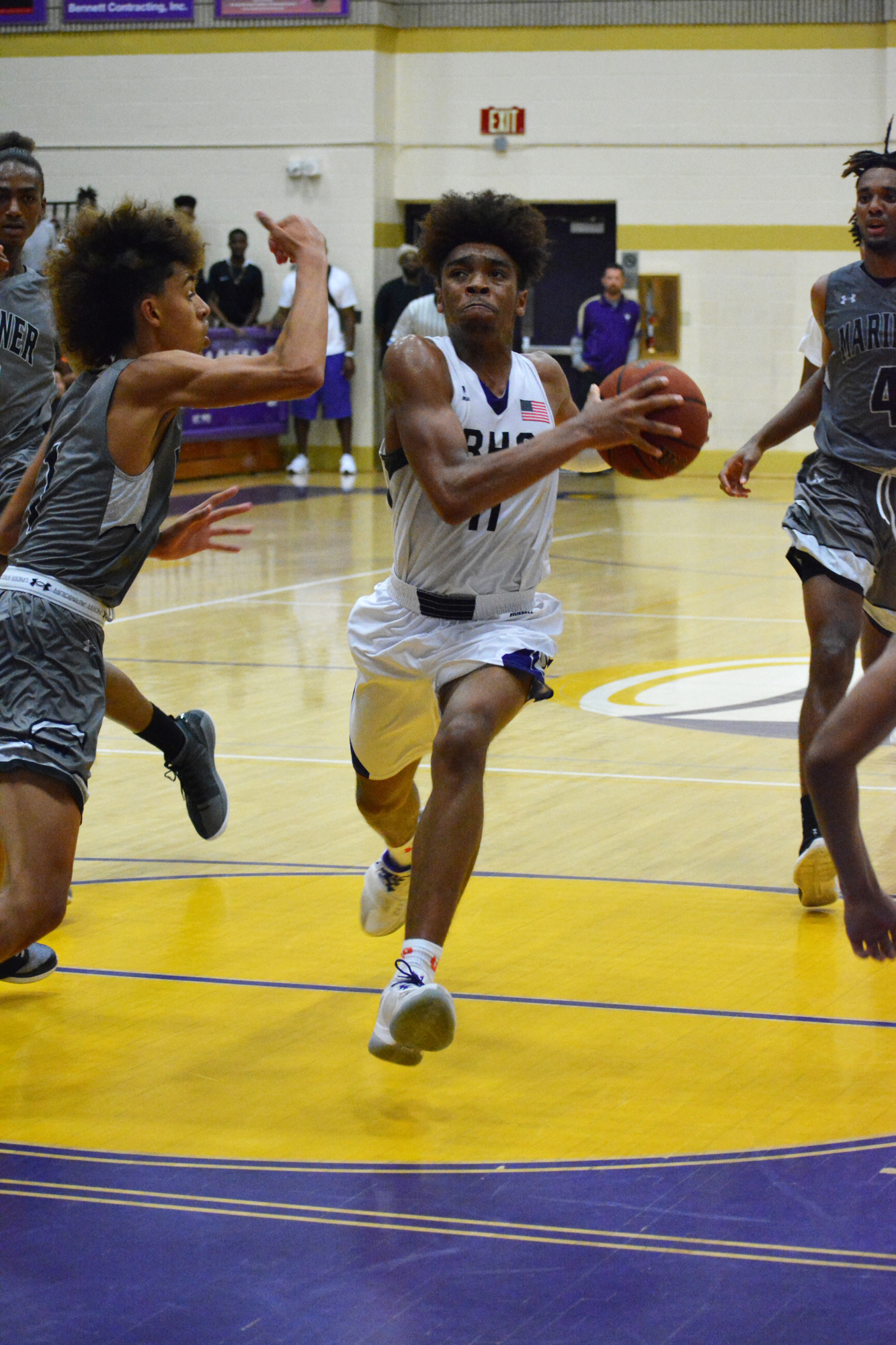 8. Booker's Johnnie Williams IV drives the lane against Mariner High.