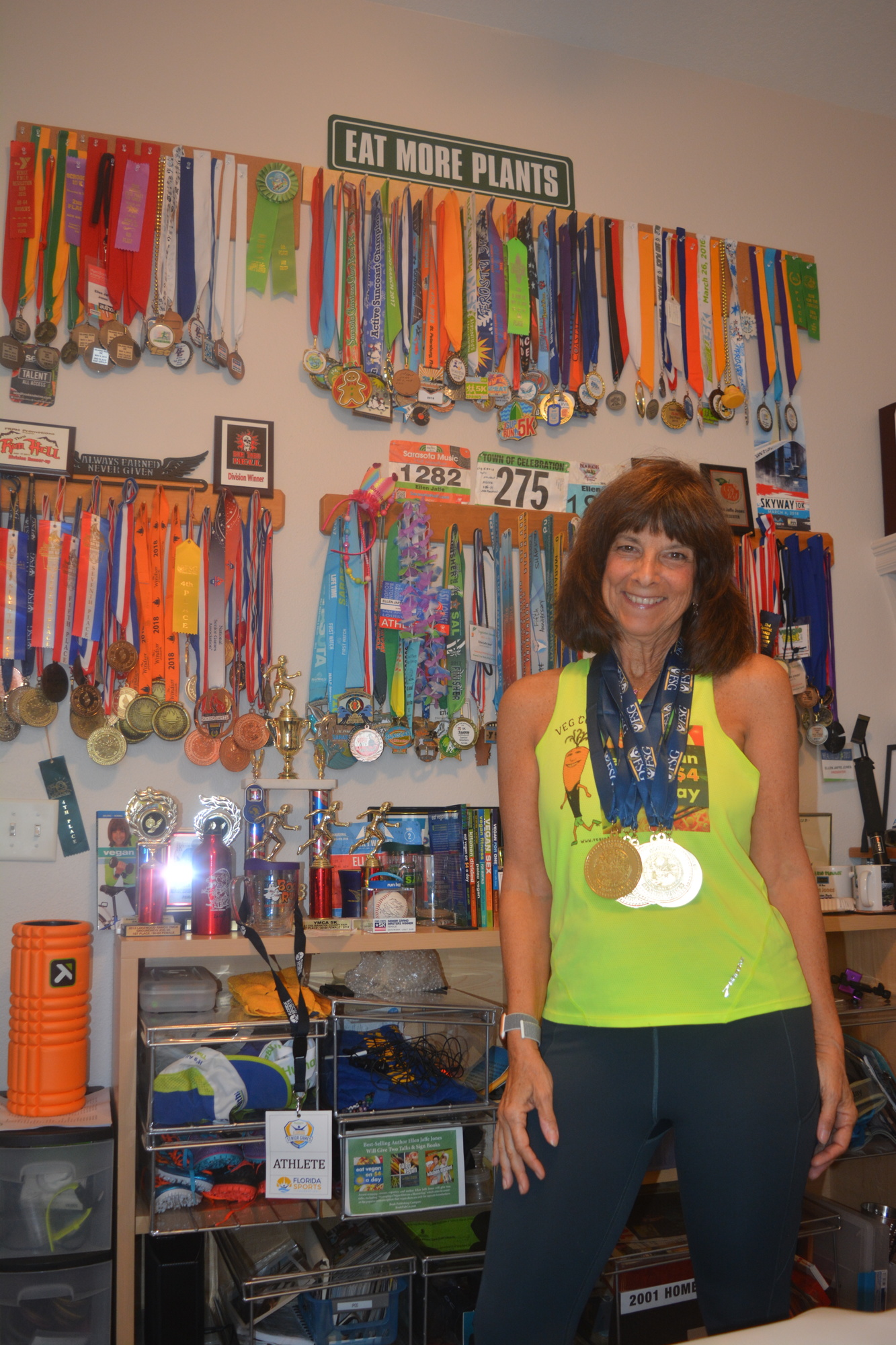 Ellen Jaffe Jones poses with her six 2018 Florida Senior Games medals, alongside her other 148 medals she has earned over the years.