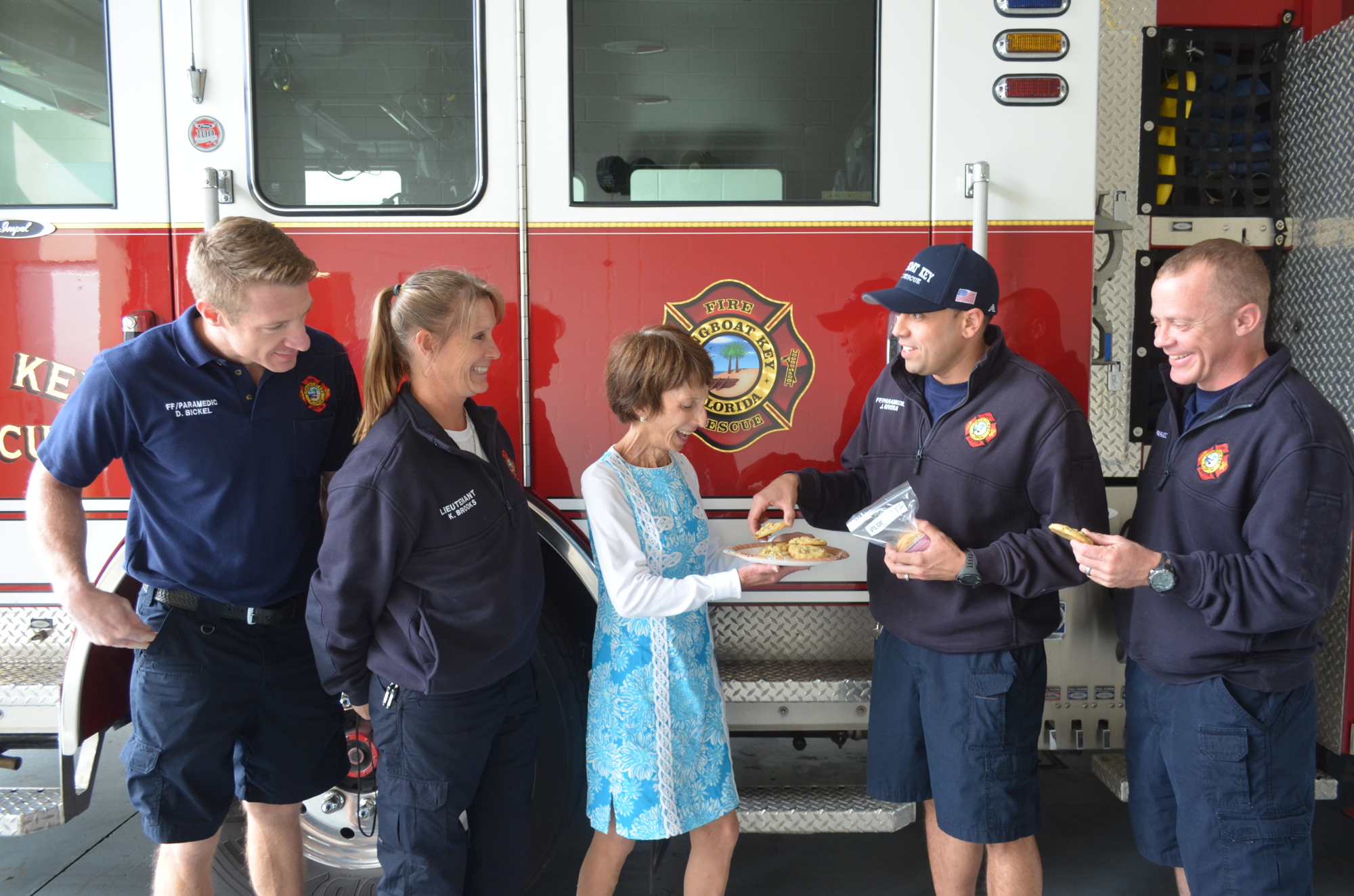 Maryann Mazzaferro bakes cookies and shares them with the community. Here she gives them to the Longboat Key Fire Rescue.