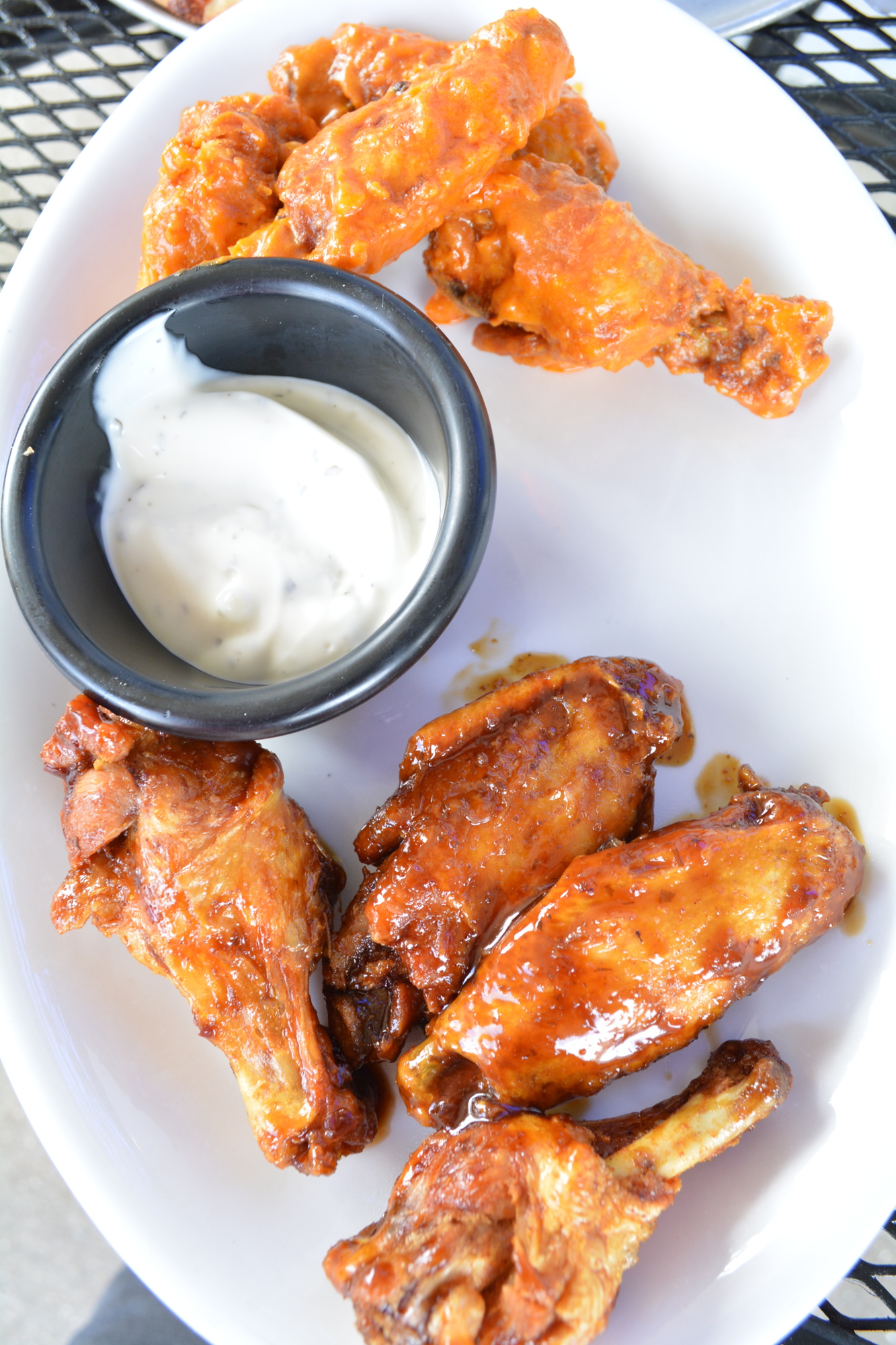 Wings are baked, then fried so they stay extra crispy, owner John Cox says.