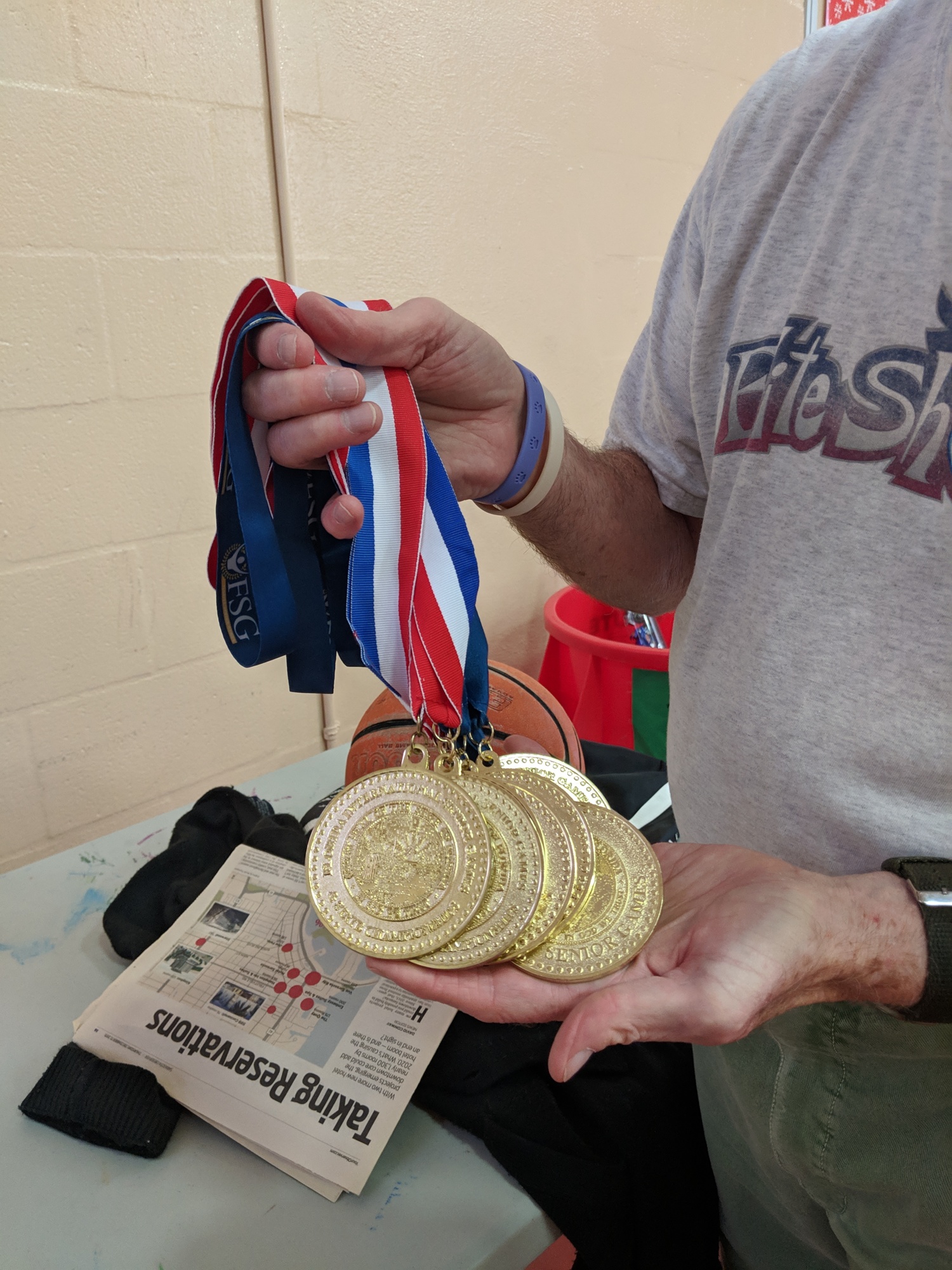 Ron Wyckoff shows off his Florida Senior Games gold medals.