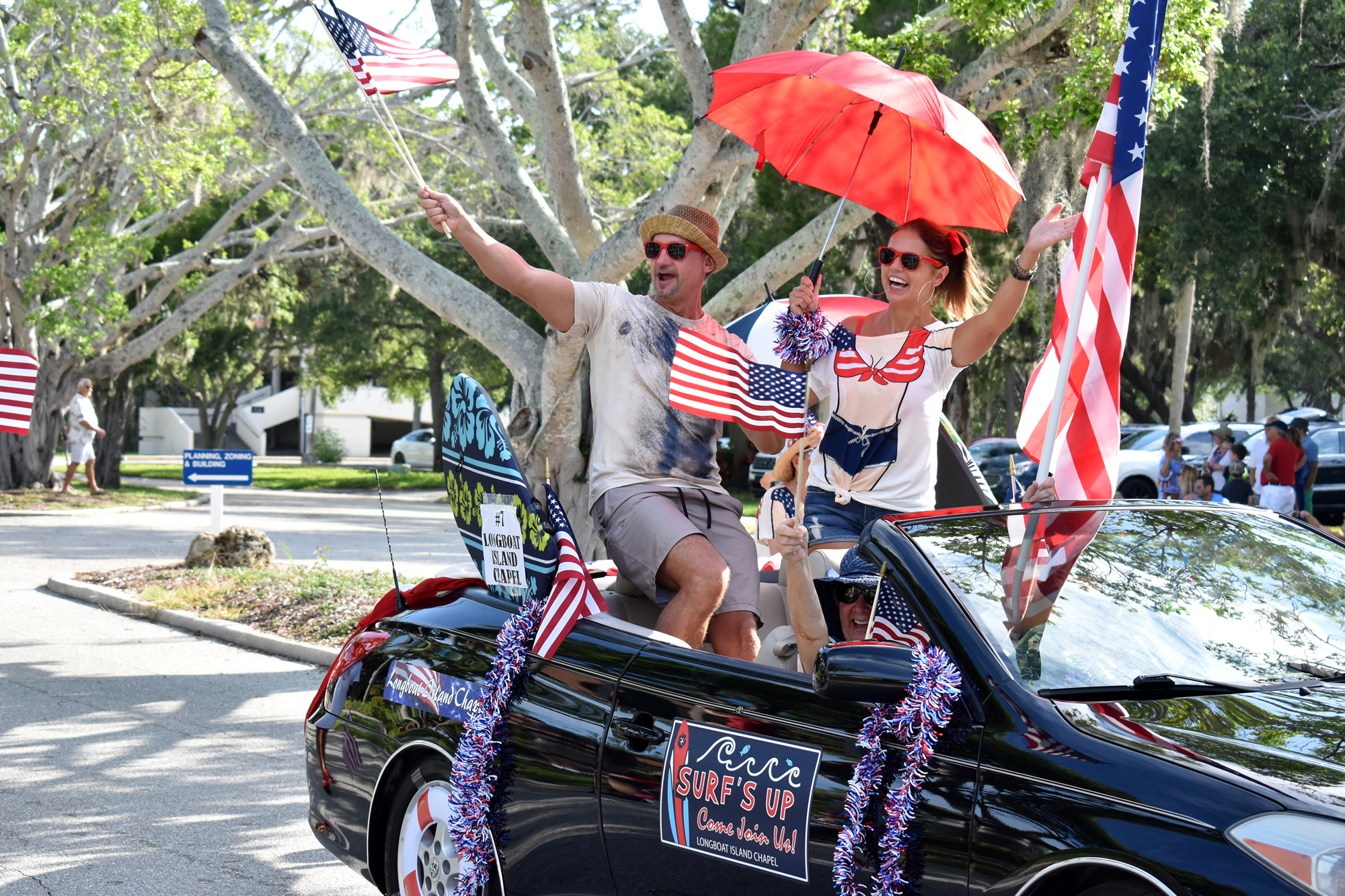 Chad Myers and Joanna Wnuk wave to the crowd during the 2018 Freedom Fest parade.