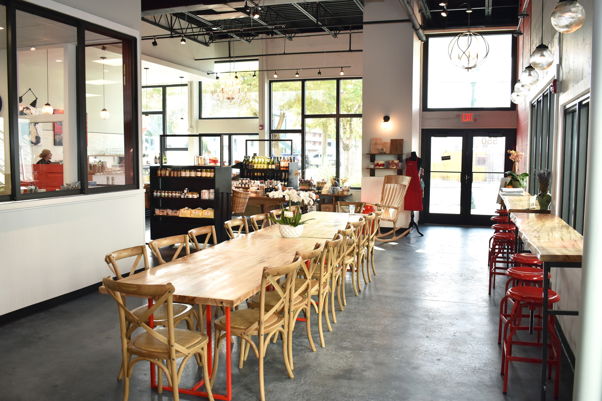 The new Artisan Cheese Co. features a long community-style table in the middle of the shop. Photo by Niki Kottmann