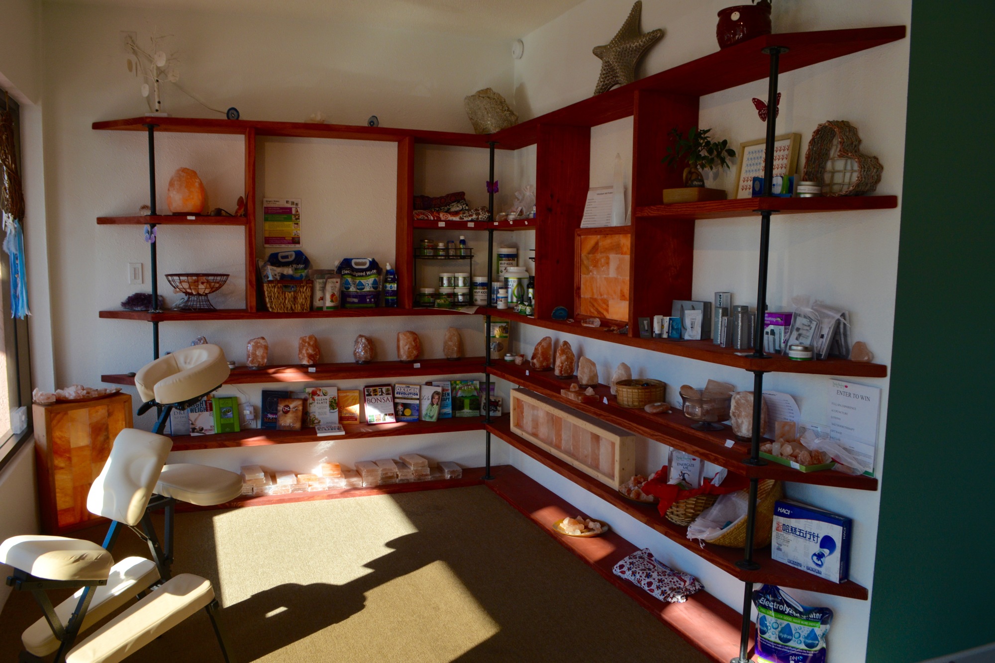 Salt lamps, pH-balanced water, reading materials and more are sold at Siesta Healing.