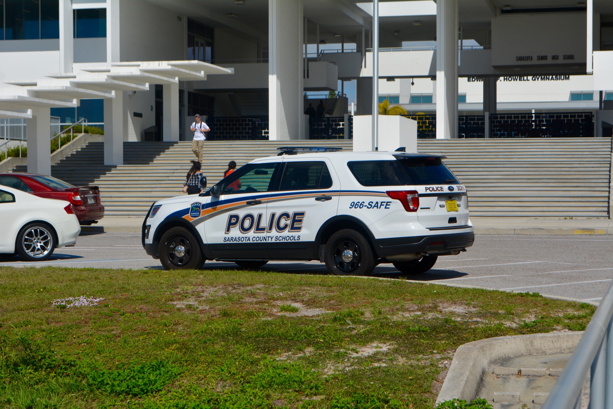 A Sarasota County Schools Police Department vehicle sits at the front of Sarasota High School's campus.