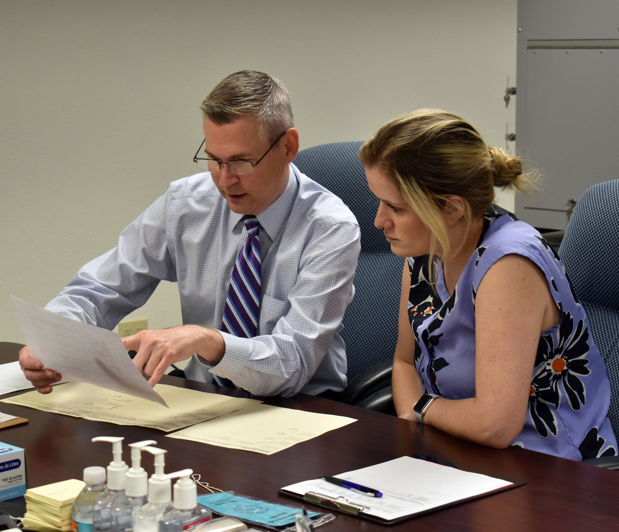 Sarasota County Supervisor of Elections Ron Turner shows Longboat Key deputy town clerk Savannah Schield how to read voting results.