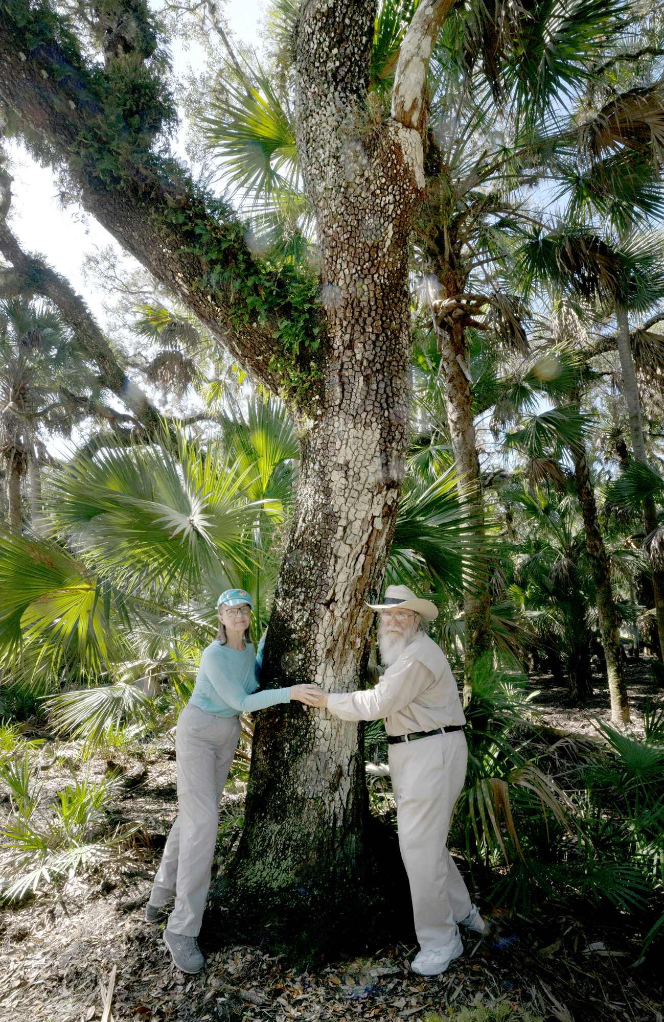 Niki and Clyde Butcher live up to the term “tree huggers.” Photo by Jackie Obendorf