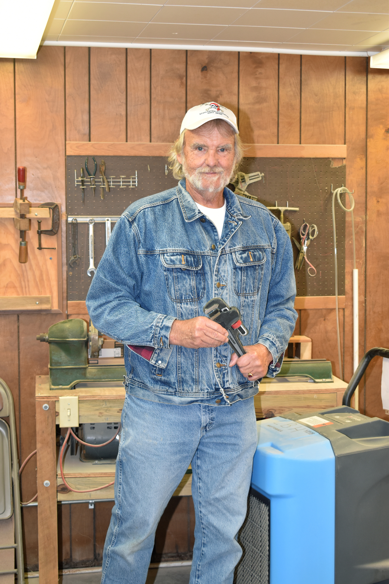 John Shea organizes the wood shop.