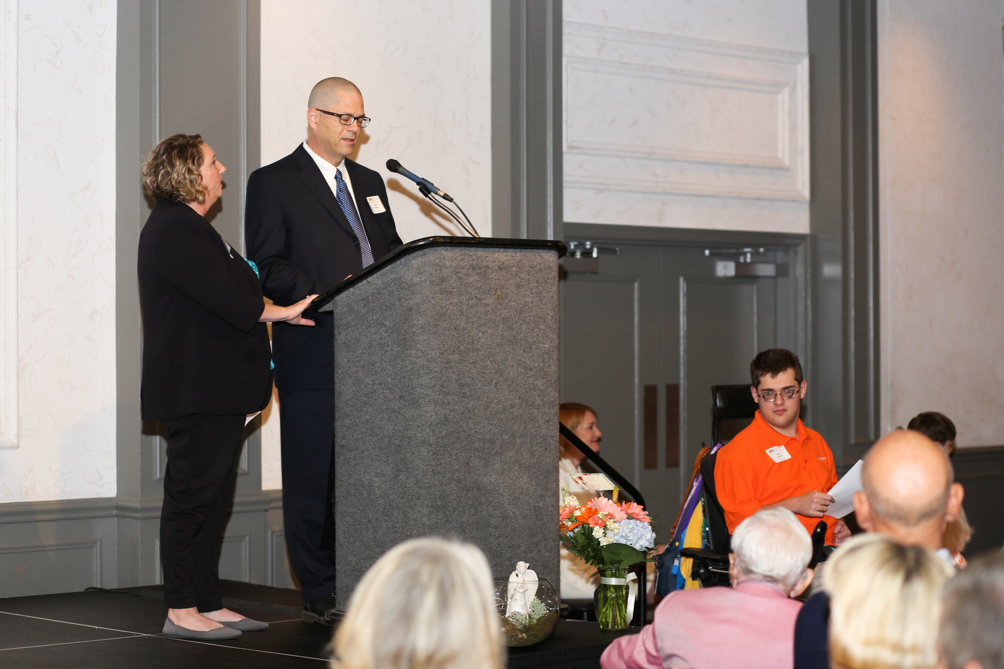 The Morano family gives a speech at the March 5 Easterseals Happiness House luncheon.