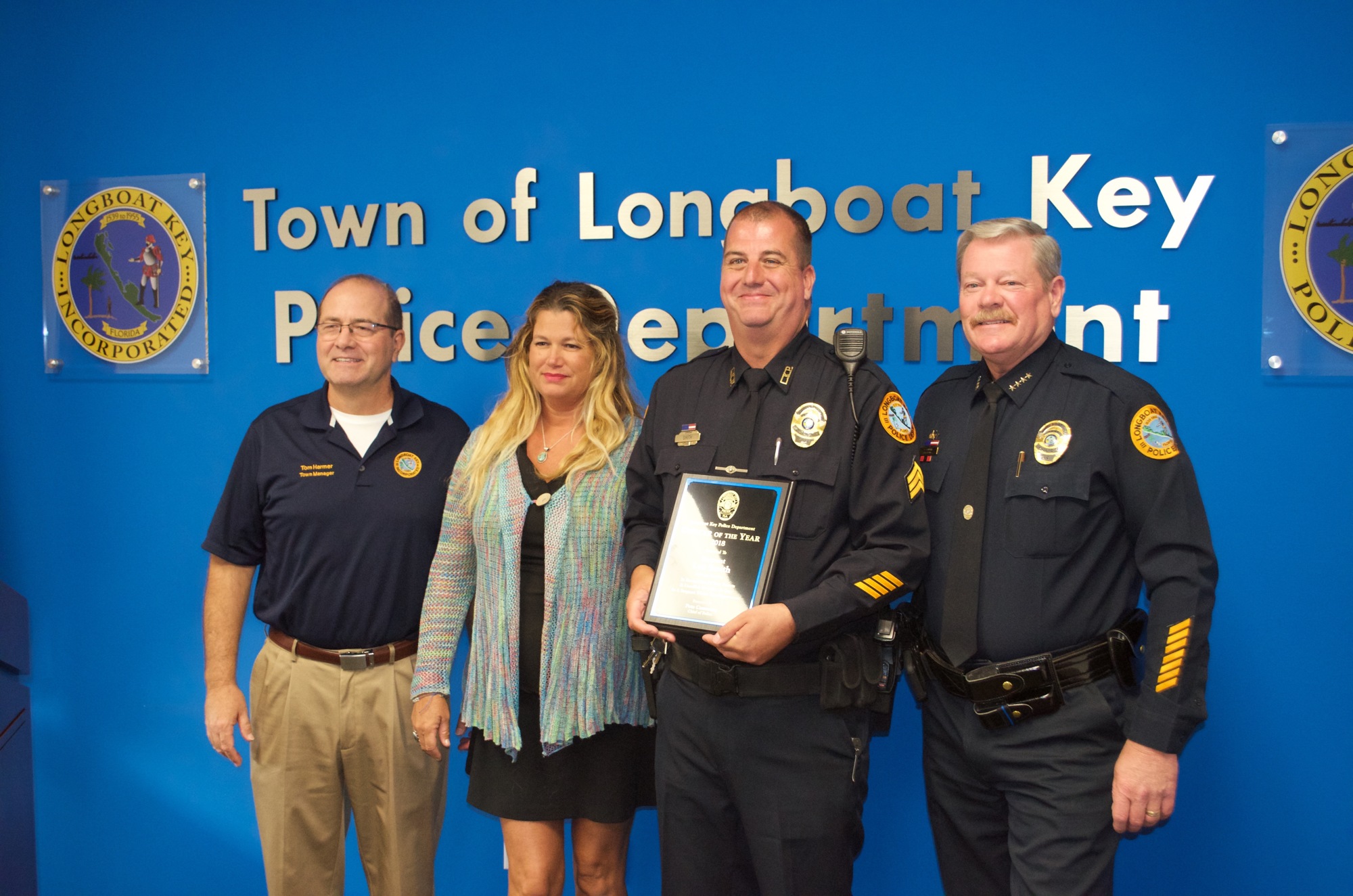 Town Manager Tom Harmer, Tahniya Smith, Sgt. Lee Smith and Police Chief Pete Cumming stand for photos after the ceremony.