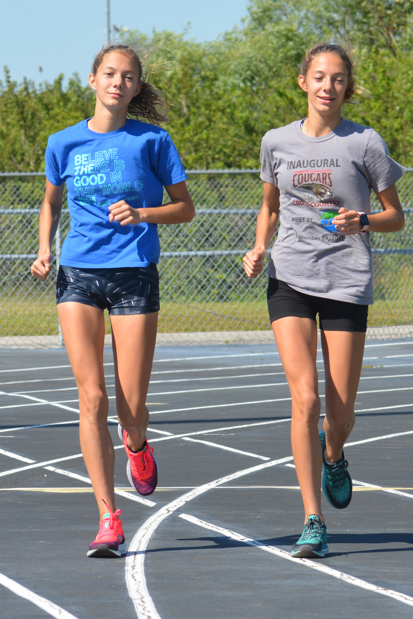 Hailey and Gracie Marston jog together at Braden River High. Both won gold at the Manatee County Championships March 14.