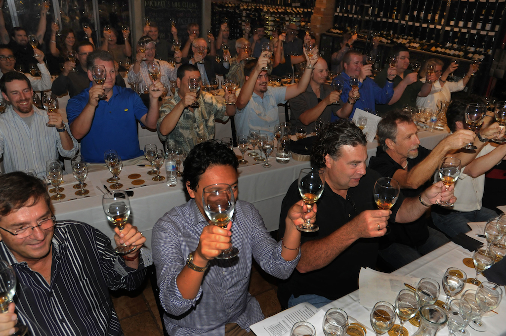 Whiskey Obsession Festival 2016's Panel of Whiskey Experts make a group toast. Courtesy photo