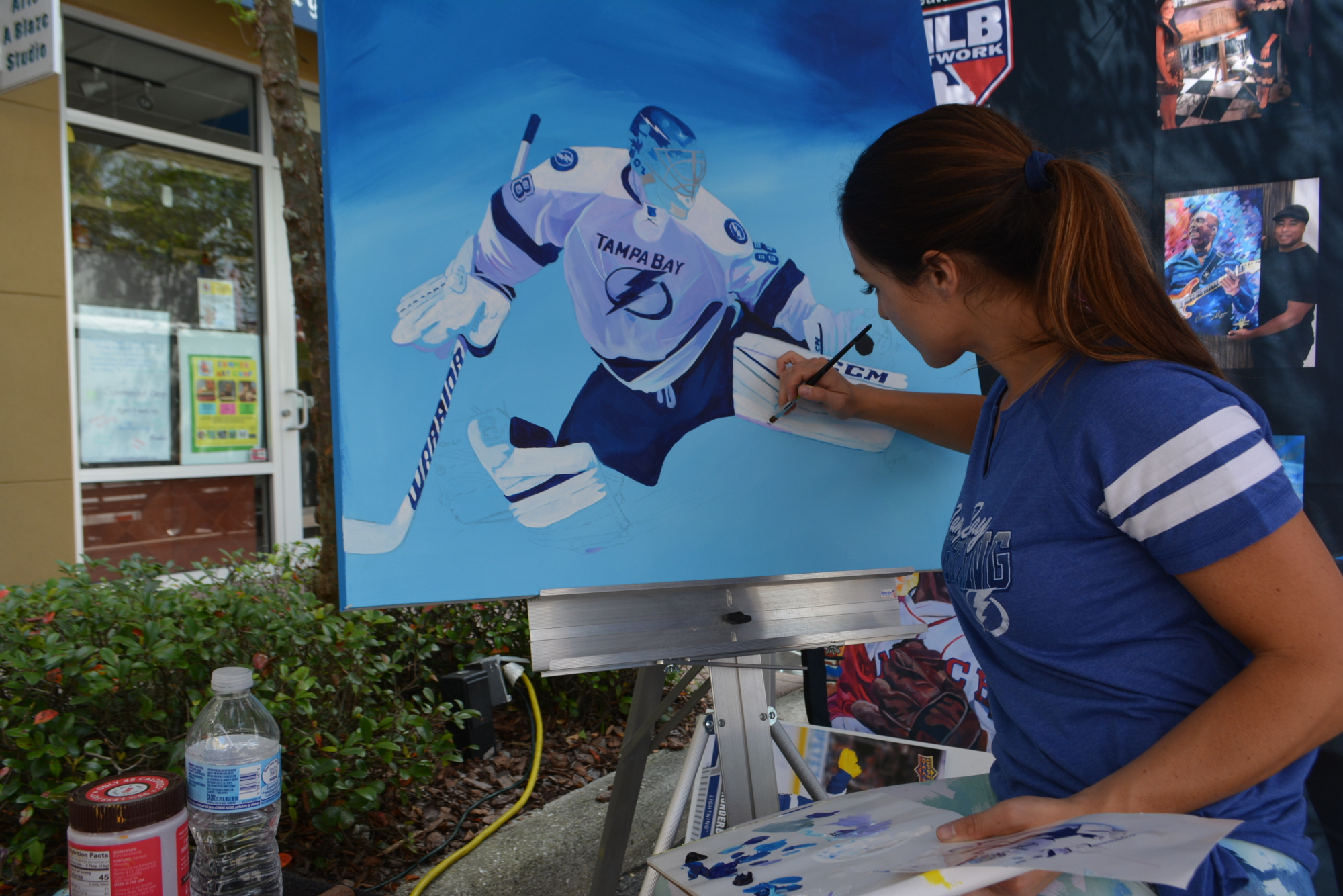 Lakewood Ranch artist Cortney Wall loves painting sporting events. She was at work putting the finishing touches on the Lightning's Andrei Vasilevskiy .Her work can be seen at cortneywall.com.