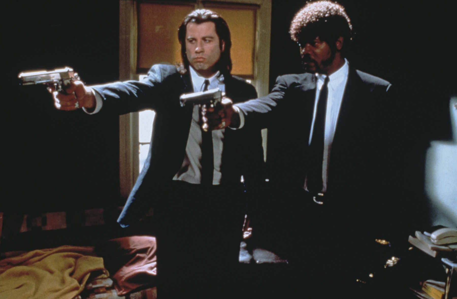 John Travolta as Vincent Vega and Samuel L. Jackson as Jules Winnfield in 