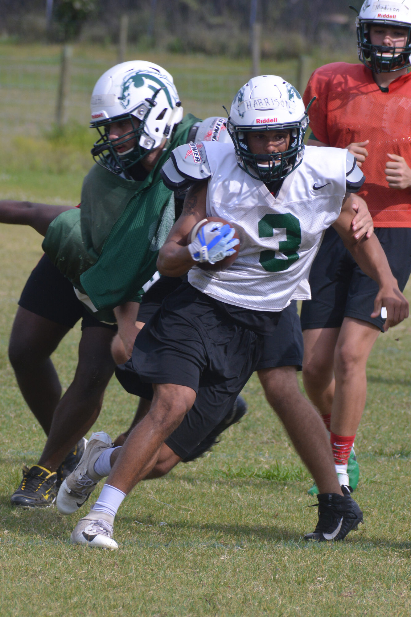 Lakewood Ranch running back Isaiah Harrison cuts past defenders during spring practice.