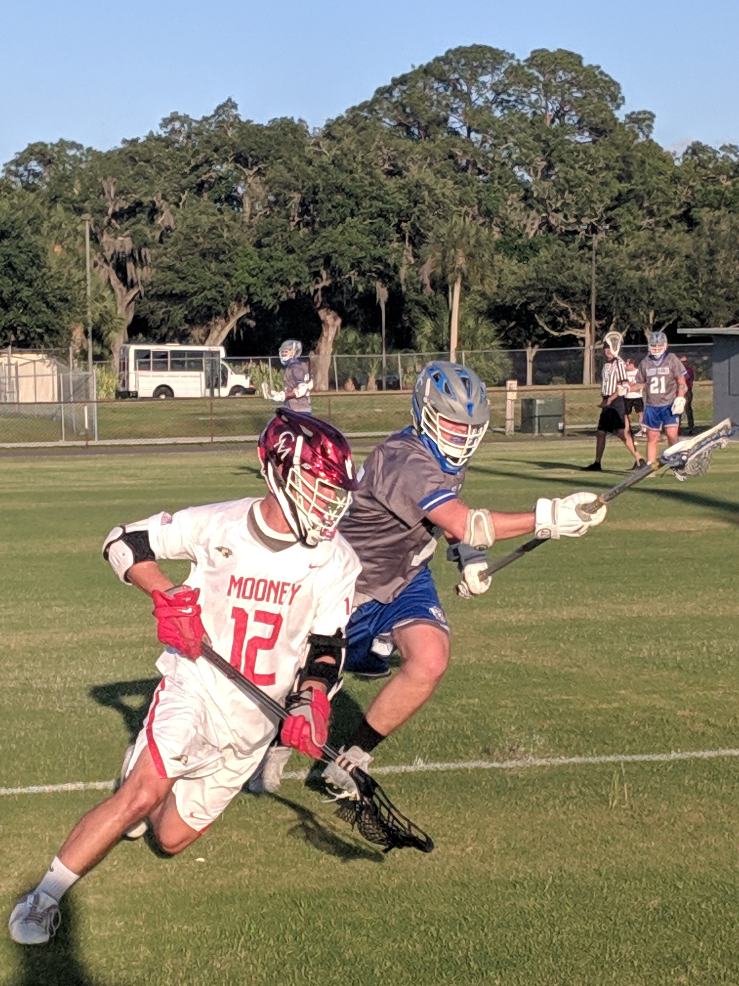 Cardinal Mooney senior Charlie Budreau navigates through the Barron Collier defense. He finished with two goals and 10 ground balls.