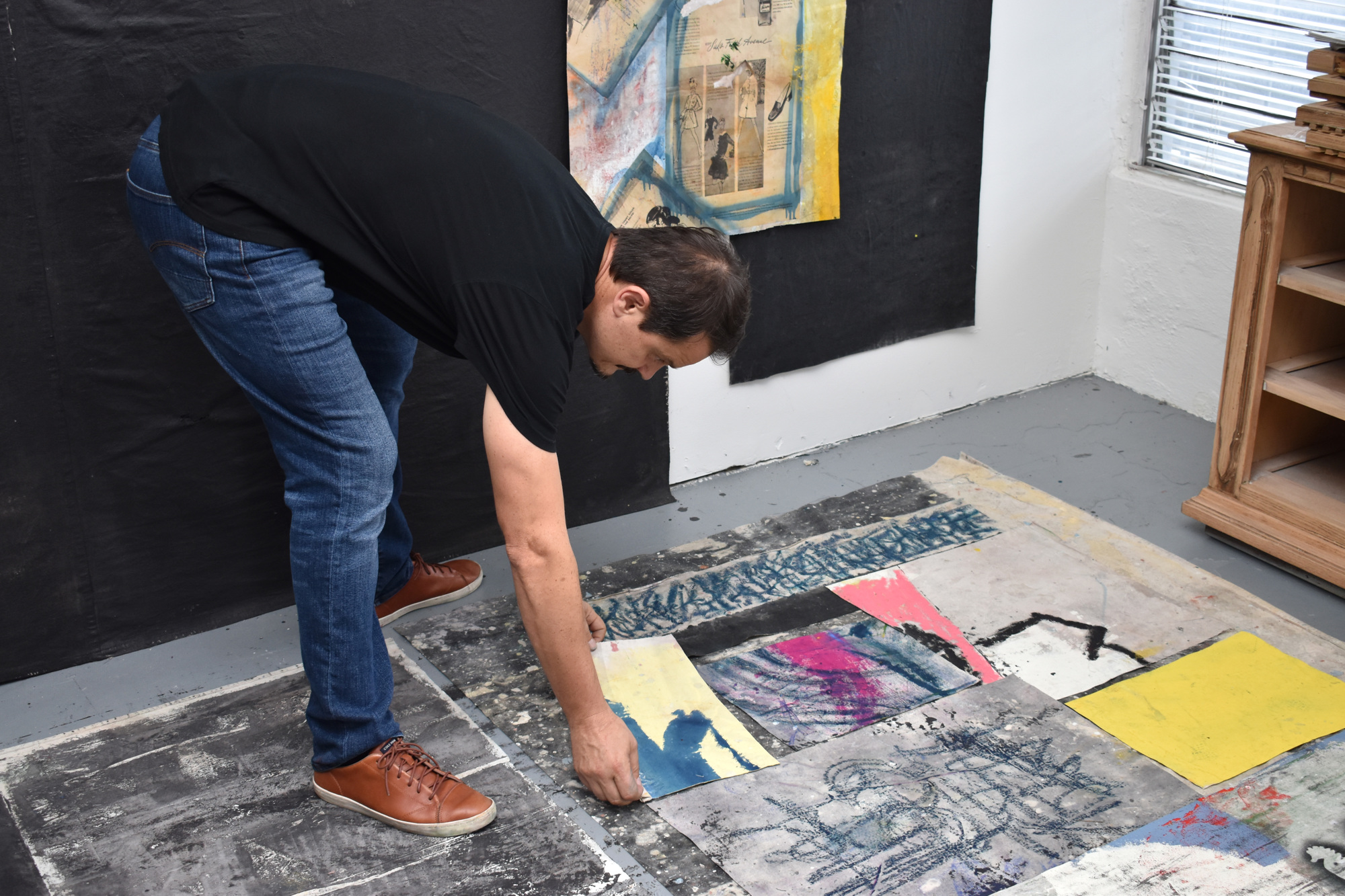 Jozef Batko likes to arrange the pieces of his works on the floor before hanging them. Photo by Niki Kottmann