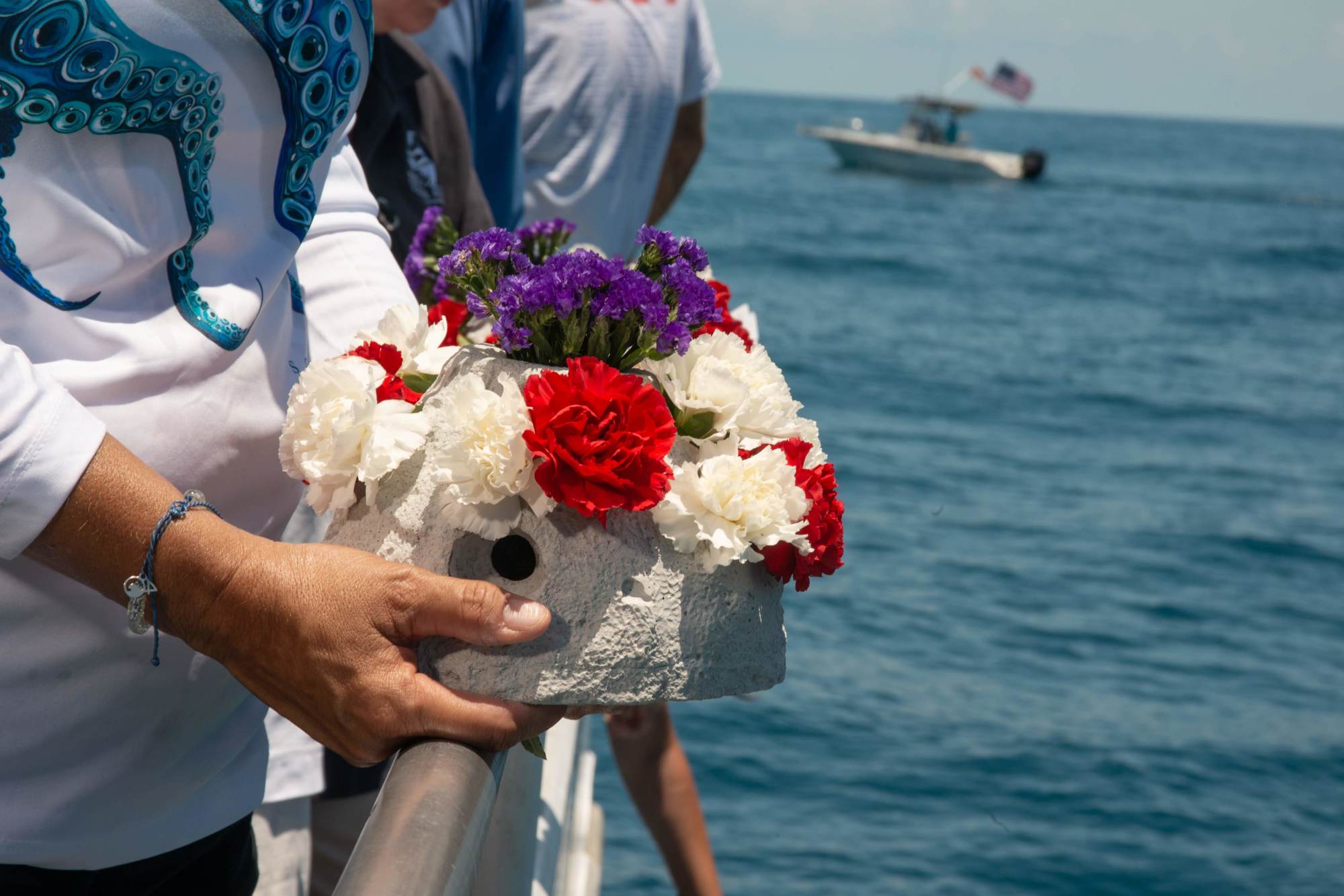 During the dedication, participants dropped 65 tribute reefs into the water. 