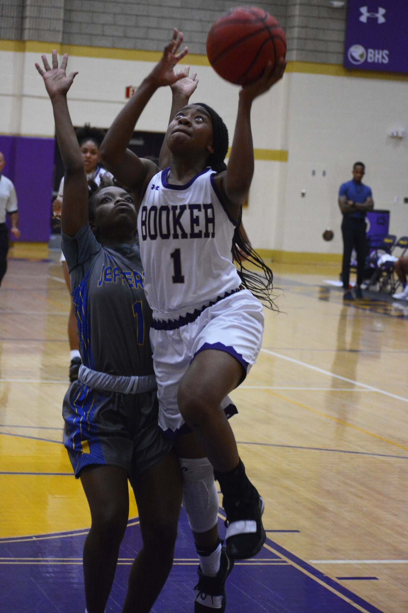 8. Junior Booker guard Jaela Dennis drives to the basket against Jefferson High.